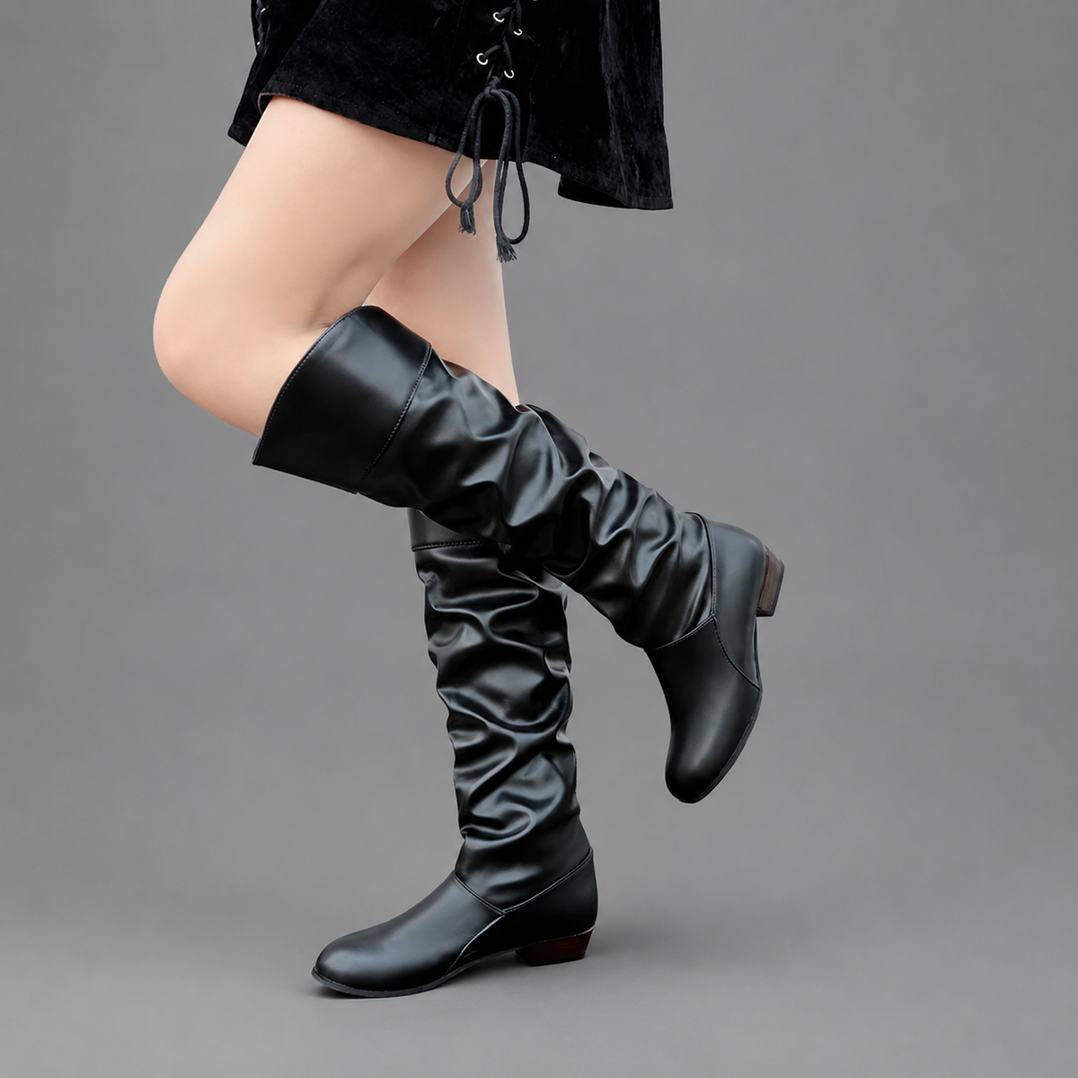 Women’s slouch knee-high boots with a smooth PU leather-look finish, relaxed shaft, low block heel, and durable rubber outsole.