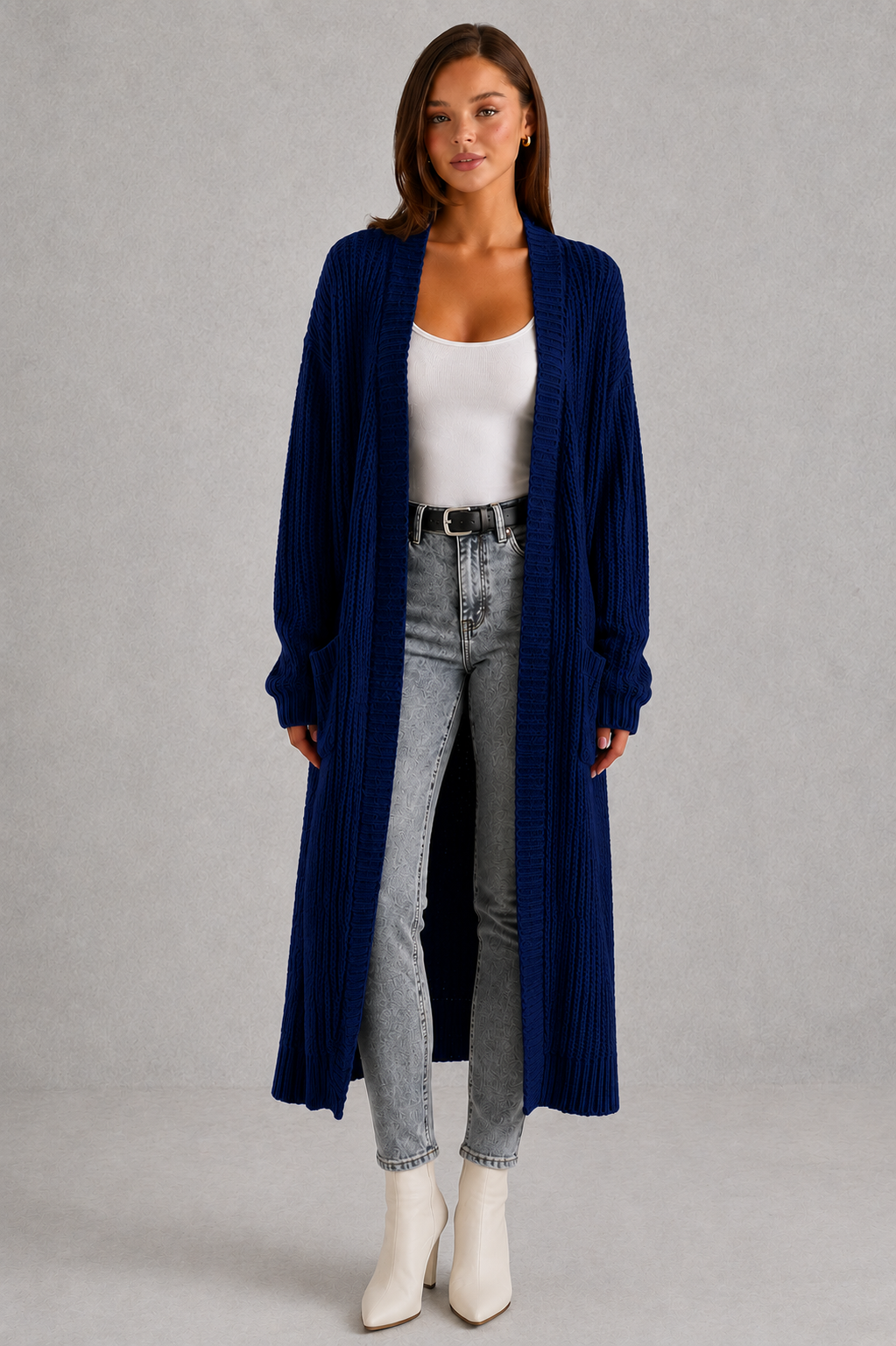 Woman wearing a relaxed-fit V-neck button cardigan sweater with a soft knit texture, styled for elegant autumn and winter layering.