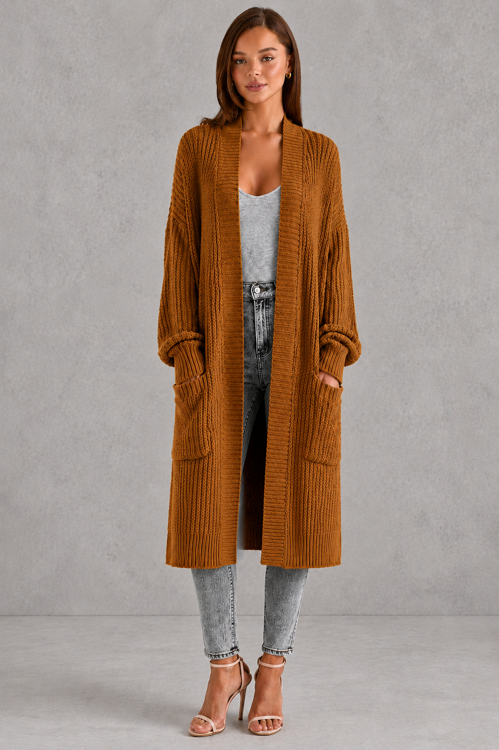 Woman wearing a relaxed-fit V-neck button cardigan sweater with a soft knit texture, styled for elegant autumn and winter layering.
