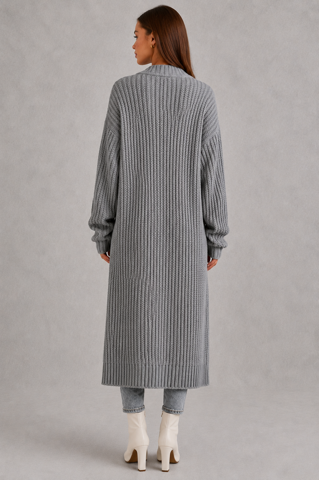 Woman wearing a relaxed-fit V-neck button cardigan sweater with a soft knit texture, styled for elegant autumn and winter layering.