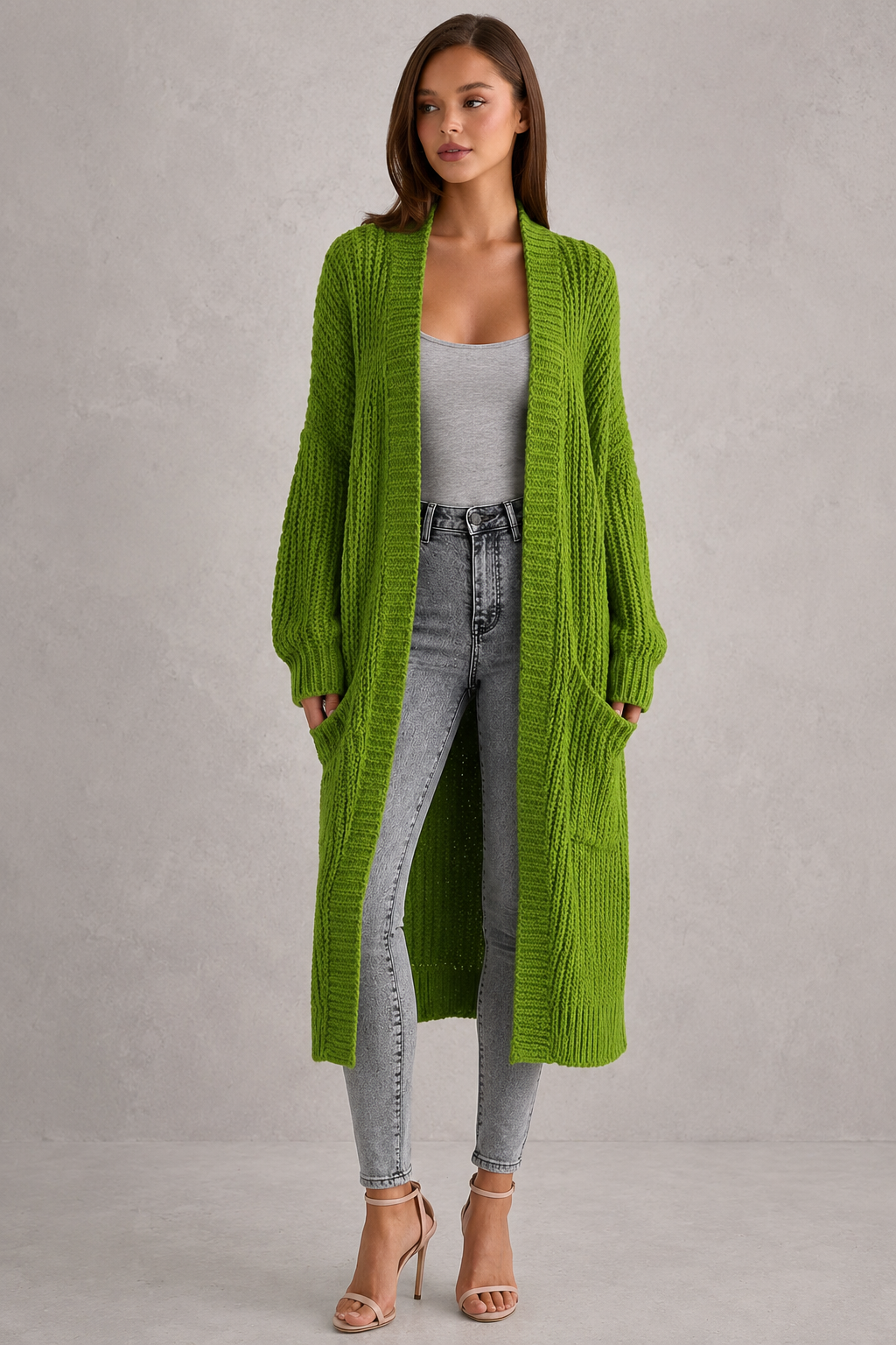 Woman wearing a relaxed-fit V-neck button cardigan sweater with a soft knit texture, styled for elegant autumn and winter layering.