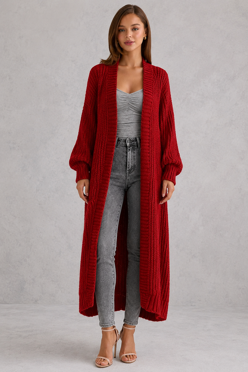Woman wearing a relaxed-fit V-neck button cardigan sweater with a soft knit texture, styled for elegant autumn and winter layering.