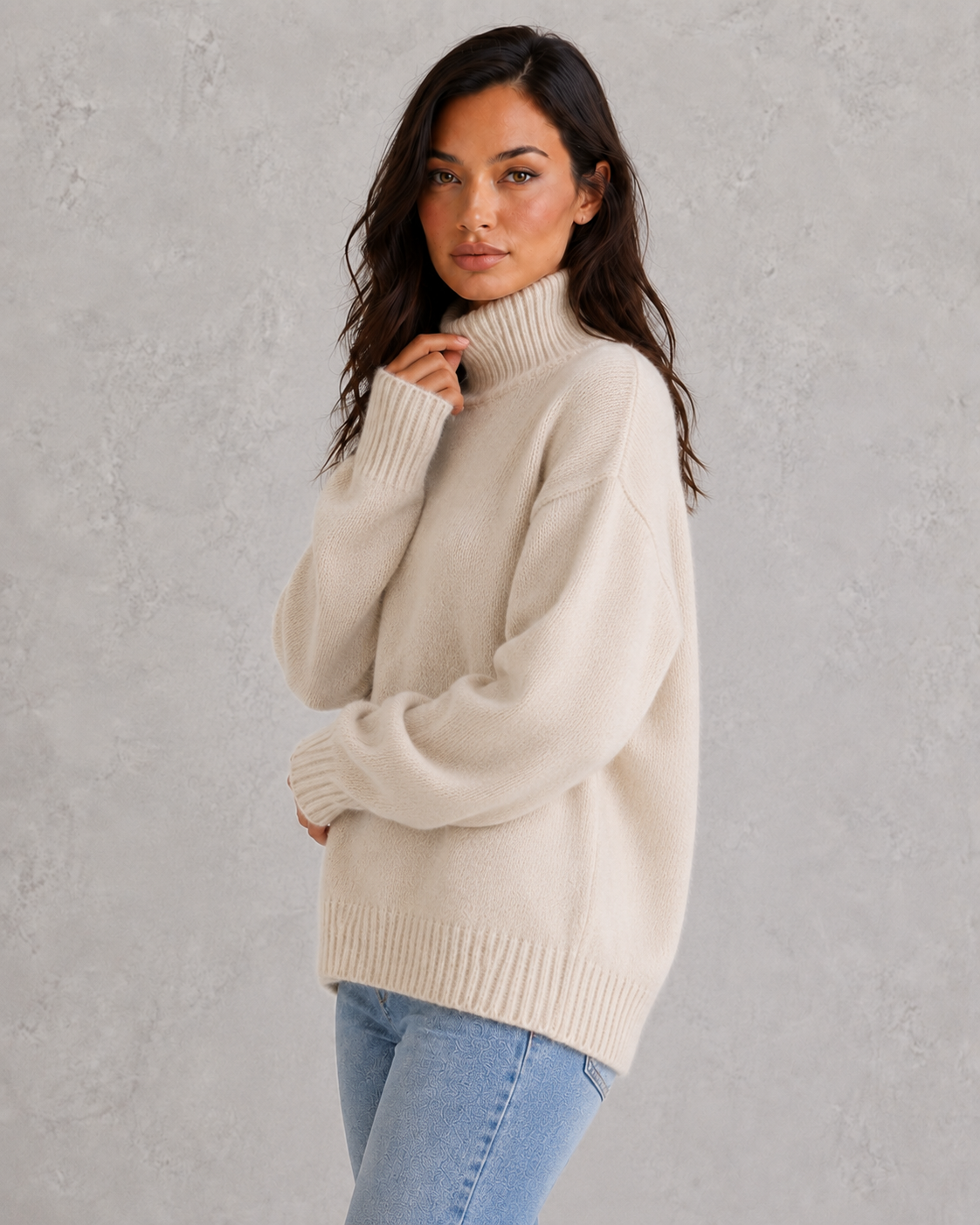 Women's soft cashmere turtleneck sweater with relaxed fit and elegant cold-weather styling.