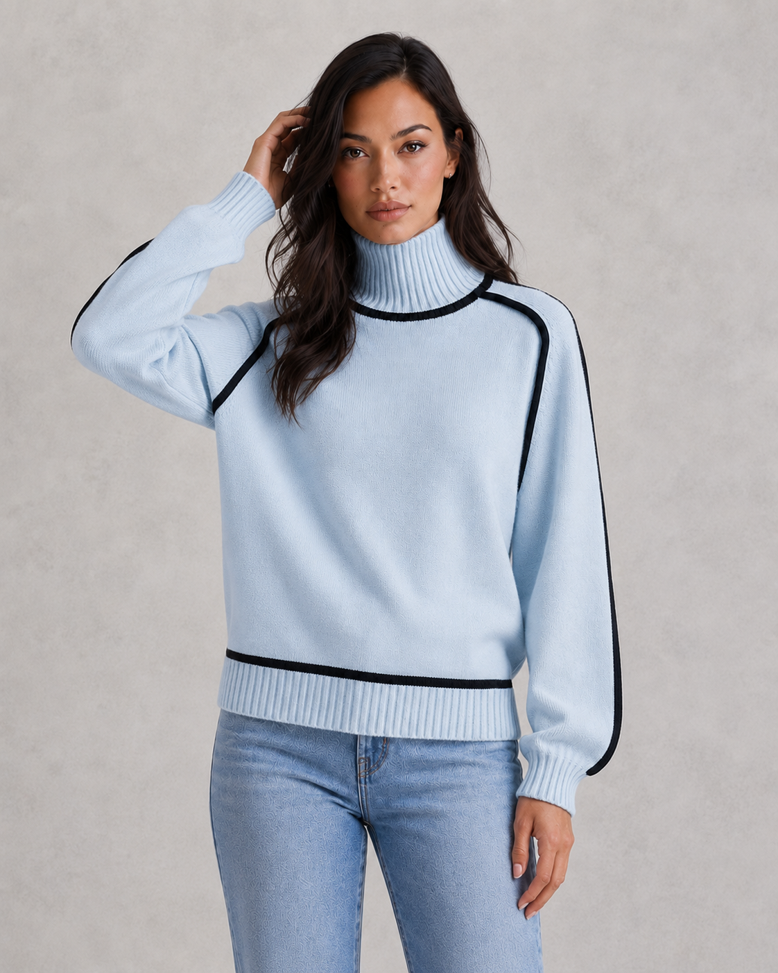 Woman wearing a soft merino wool turtleneck sweater with a relaxed fit and elegant winter styling.