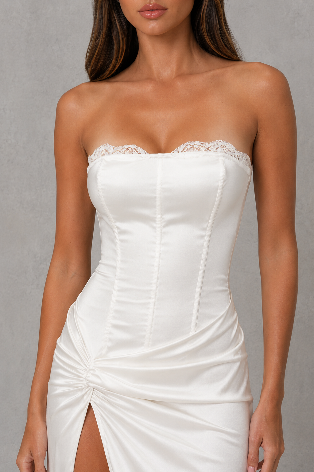 Women’s strapless satin corset maxi dress with a structured bodice, pleated detailing, fitted waist, flowing skirt, and elegant high slit.
