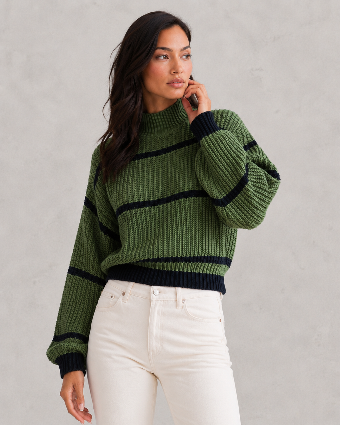 Women's striped knit turtleneck sweater with relaxed fit, lantern sleeves, and mock neck in a timeless autumn-winter design.