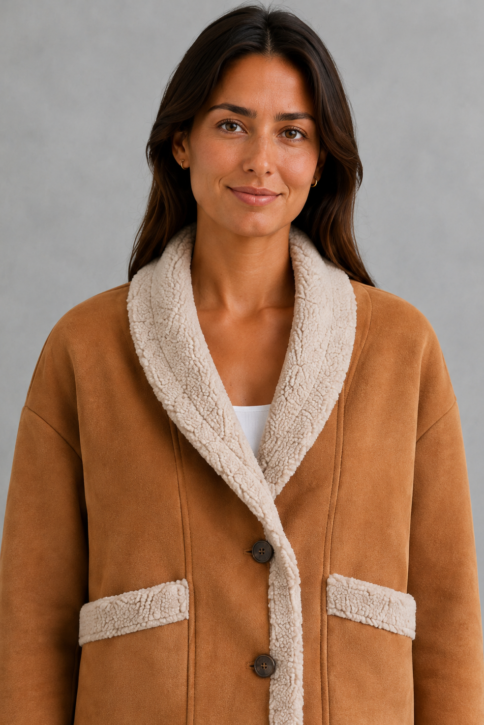 Women’s suede-look teddy coat with a soft textured finish, classic lapel collar, long sleeves, and a relaxed silhouette for comfortable layering.