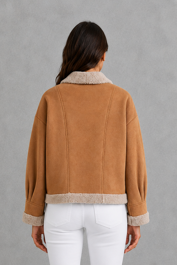 Women’s suede-look teddy coat with a soft textured finish, classic lapel collar, long sleeves, and a relaxed silhouette for comfortable layering.