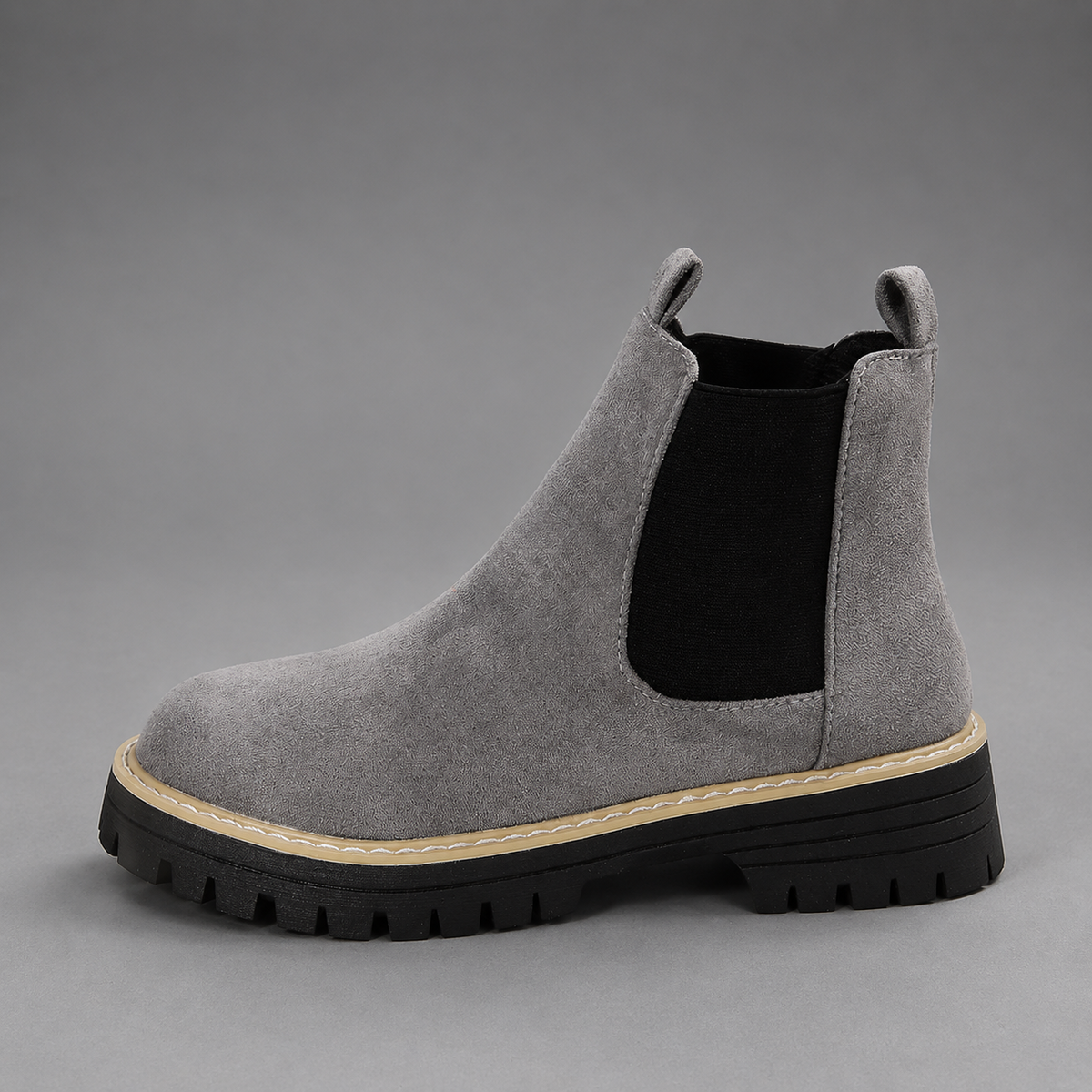 Women’s suede ankle boots with a soft suede upper, classic round toe, supportive mid-height block heel, and durable rubber outsole.