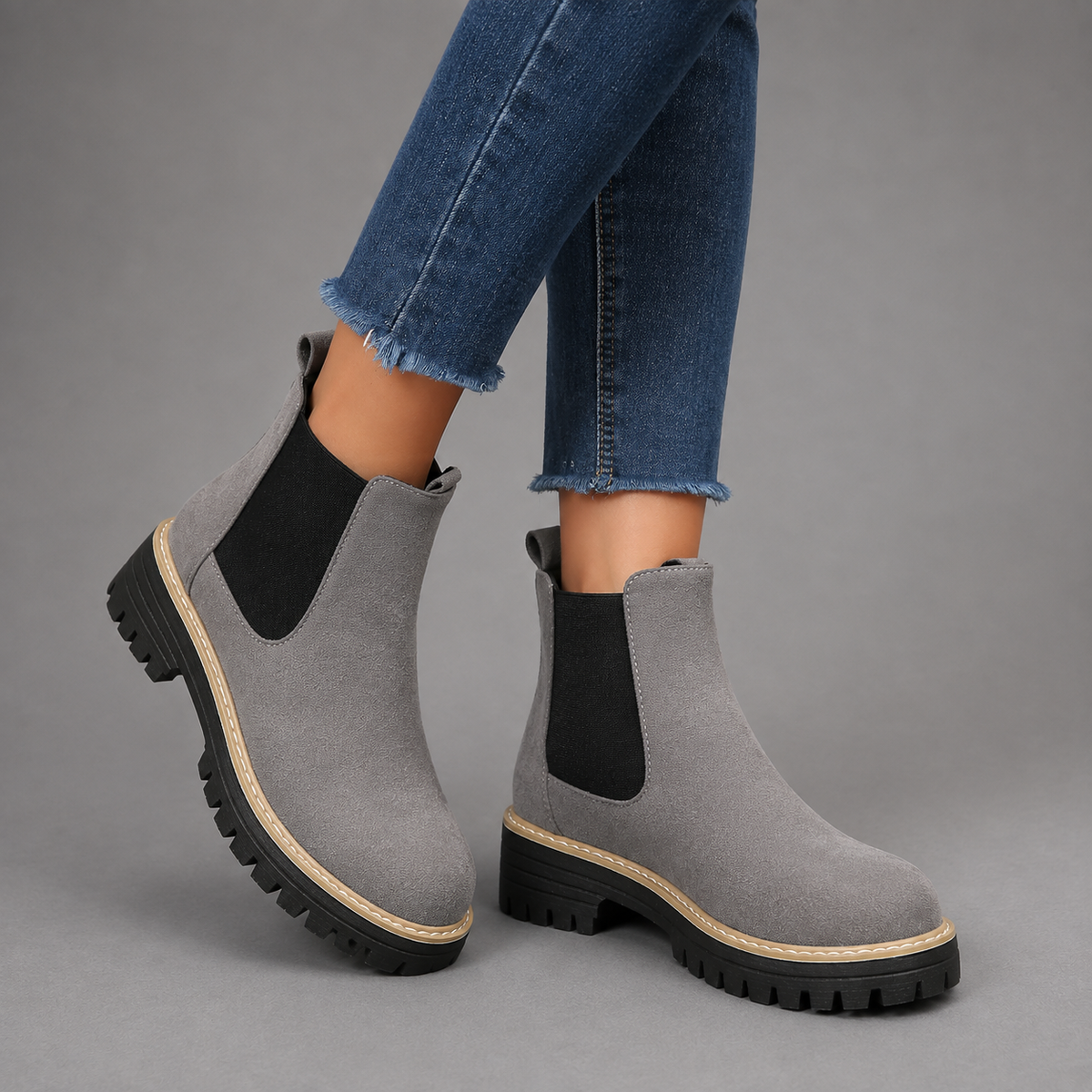 Women’s suede ankle boots with a soft suede upper, classic round toe, supportive mid-height block heel, and durable rubber outsole.