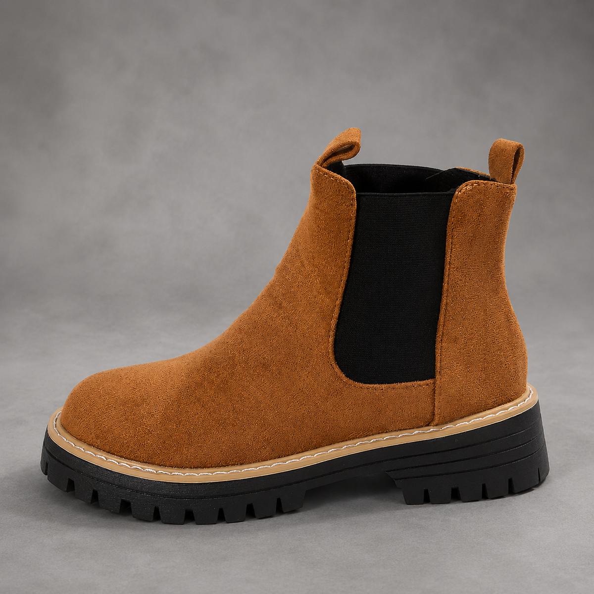 Women’s suede ankle boots with a soft suede upper, classic round toe, supportive mid-height block heel, and durable rubber outsole.