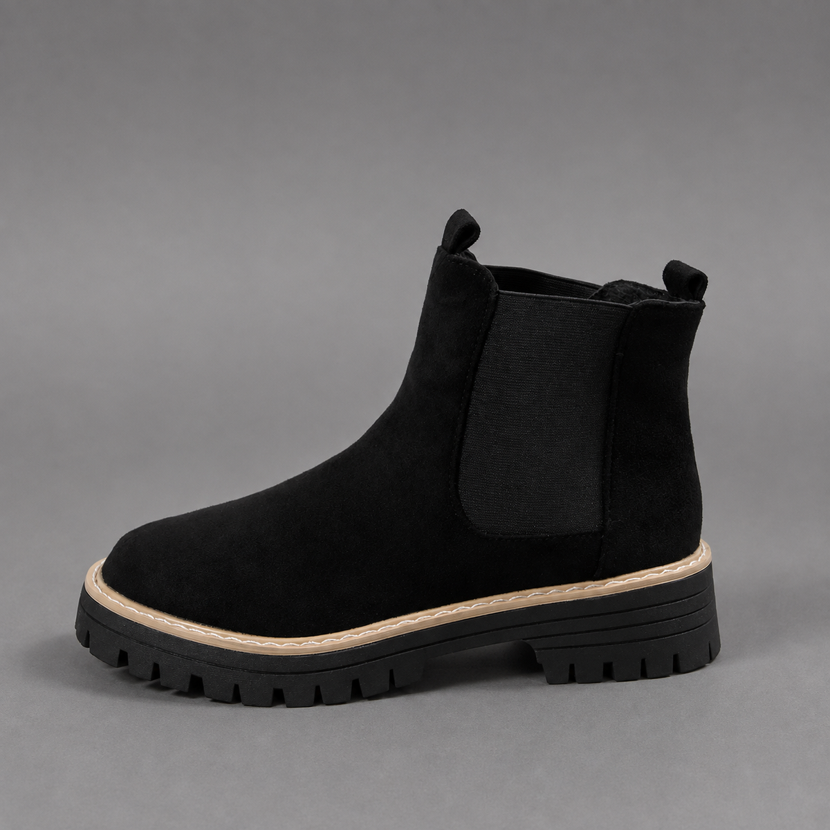 Women’s suede ankle boots with a soft suede upper, classic round toe, supportive mid-height block heel, and durable rubber outsole.