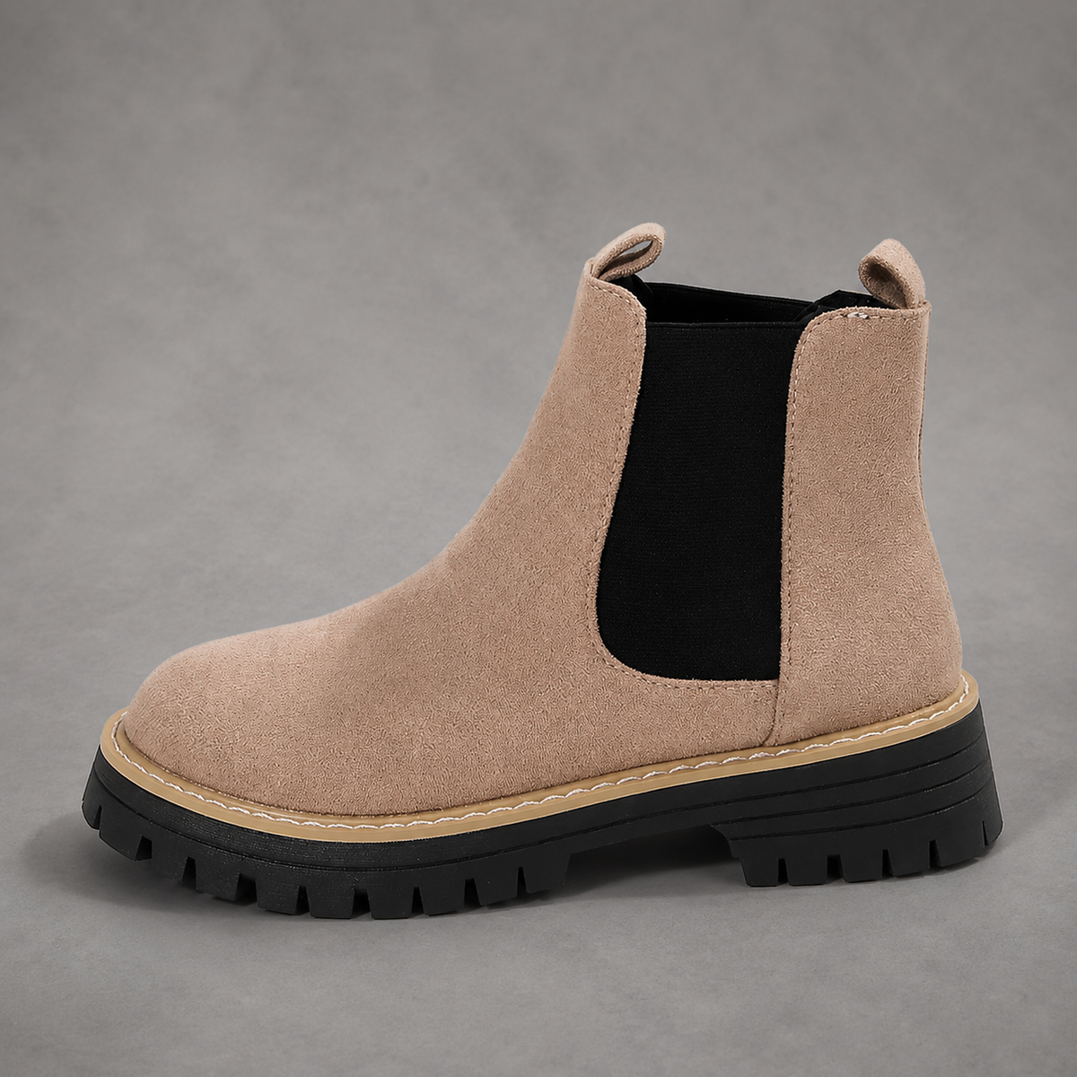 Women’s suede ankle boots with a soft suede upper, classic round toe, supportive mid-height block heel, and durable rubber outsole.
