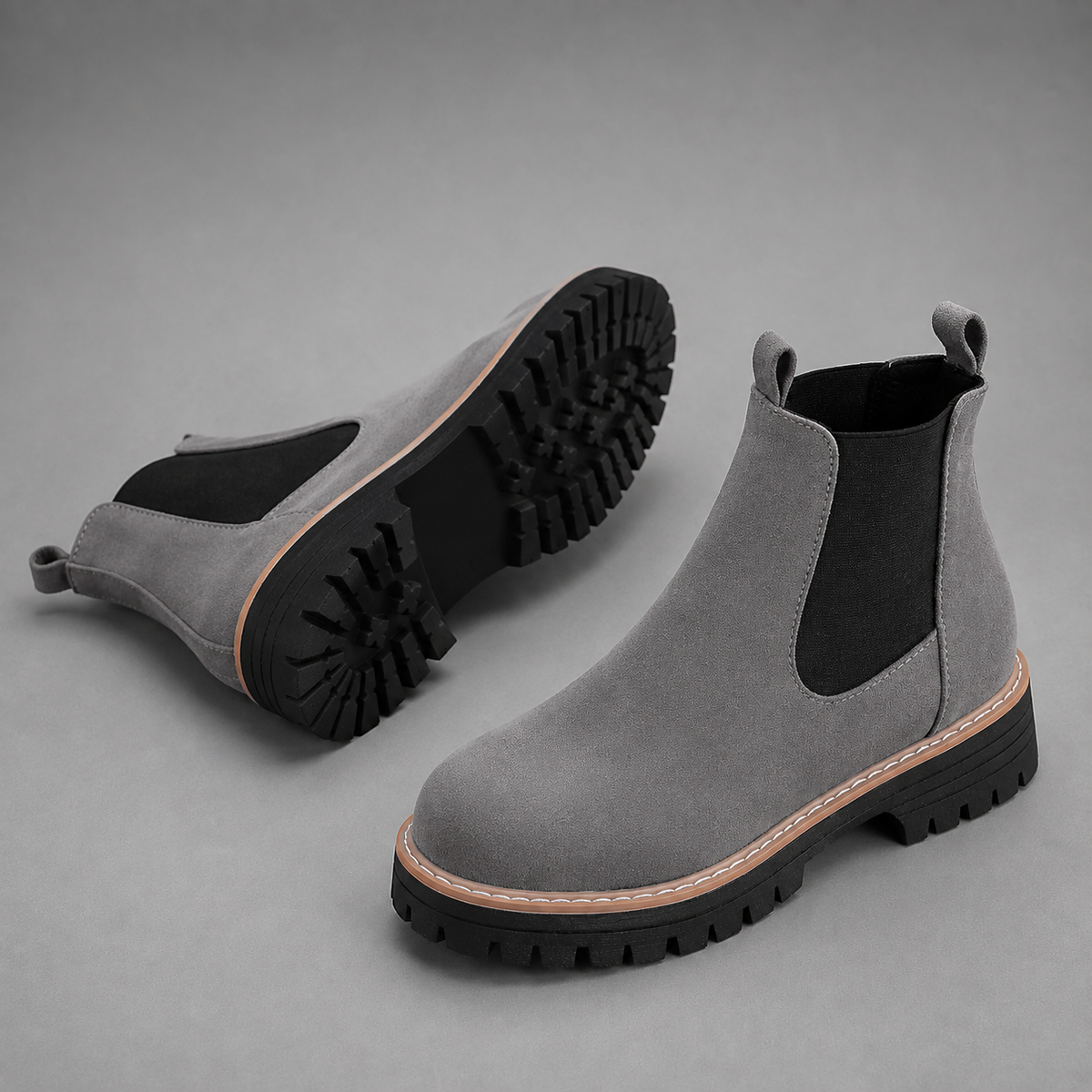 Women’s suede ankle boots with a soft suede upper, classic round toe, supportive mid-height block heel, and durable rubber outsole.