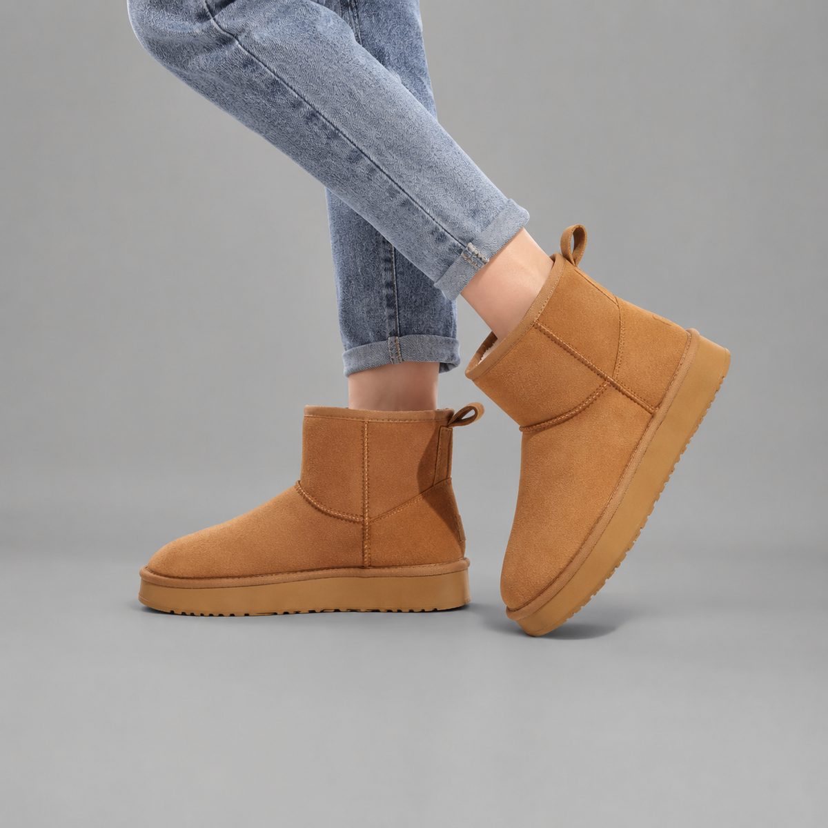 Women’s faux suede platform ankle boots with plush fur lining, chunky 2-inch sole, slip-on design, and rear pull tab.