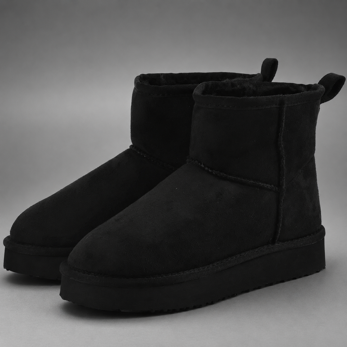 Women’s faux suede platform ankle boots with plush fur lining, chunky 2-inch sole, slip-on design, and rear pull tab.