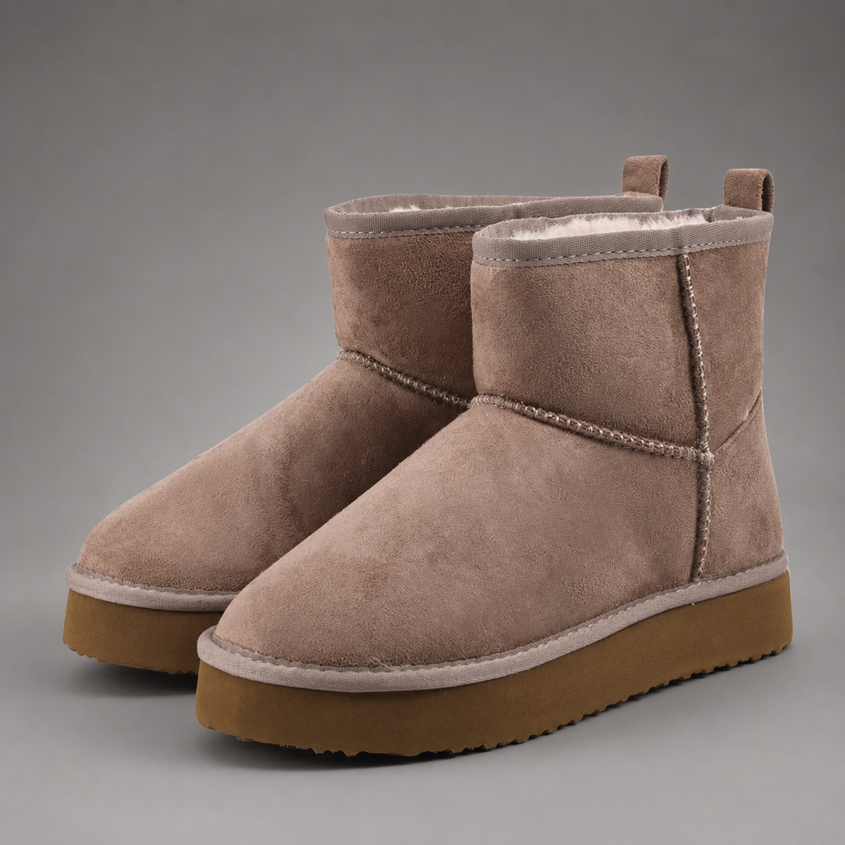 Women’s faux suede platform ankle boots with plush fur lining, chunky 2-inch sole, slip-on design, and rear pull tab.