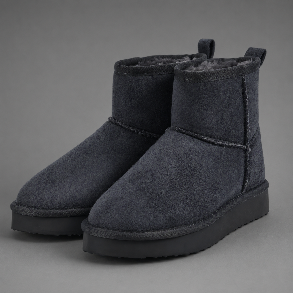 Women’s faux suede platform ankle boots with plush fur lining, chunky 2-inch sole, slip-on design, and rear pull tab.