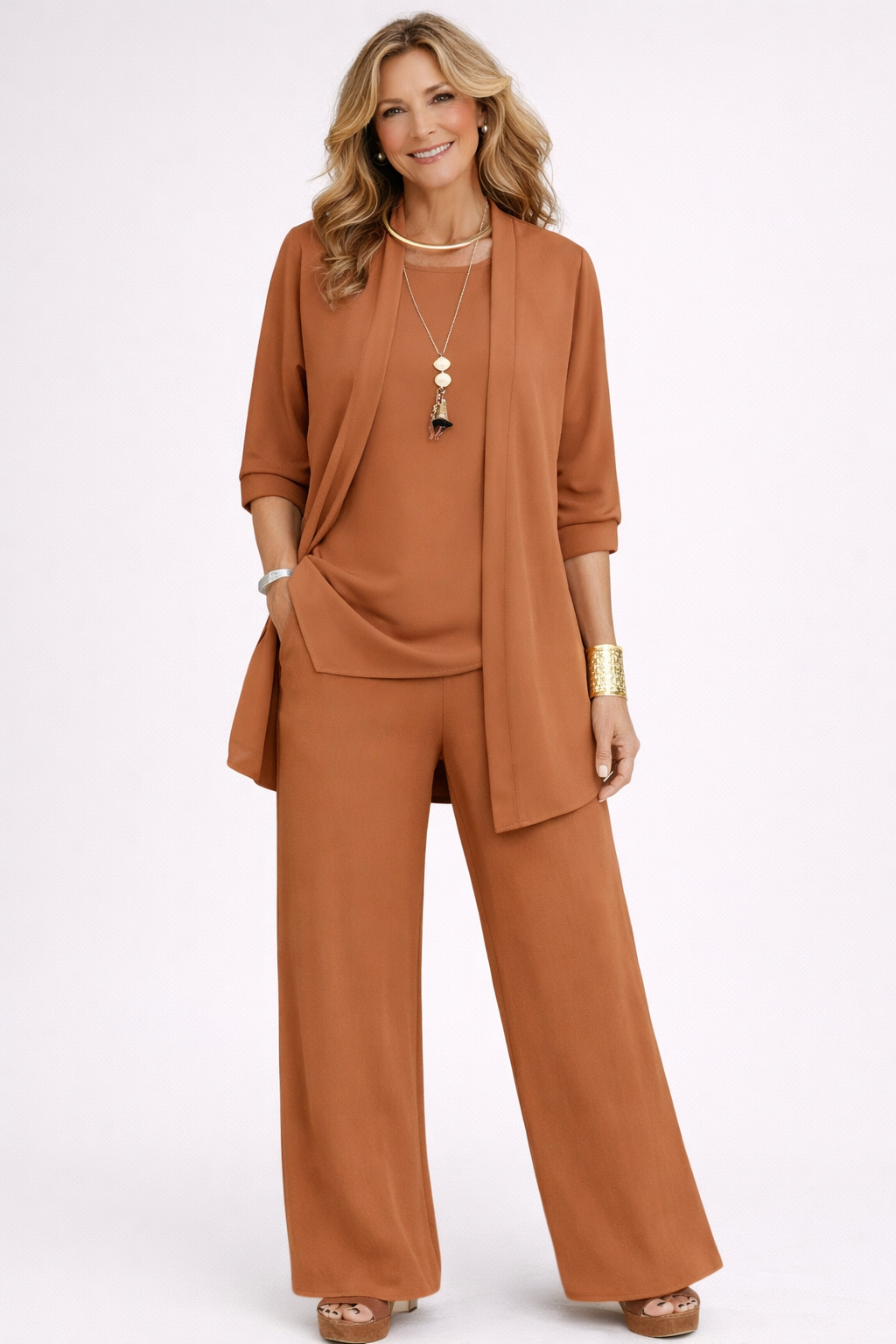 Woman wearing a brown outfit with a jacket and pants on a white background