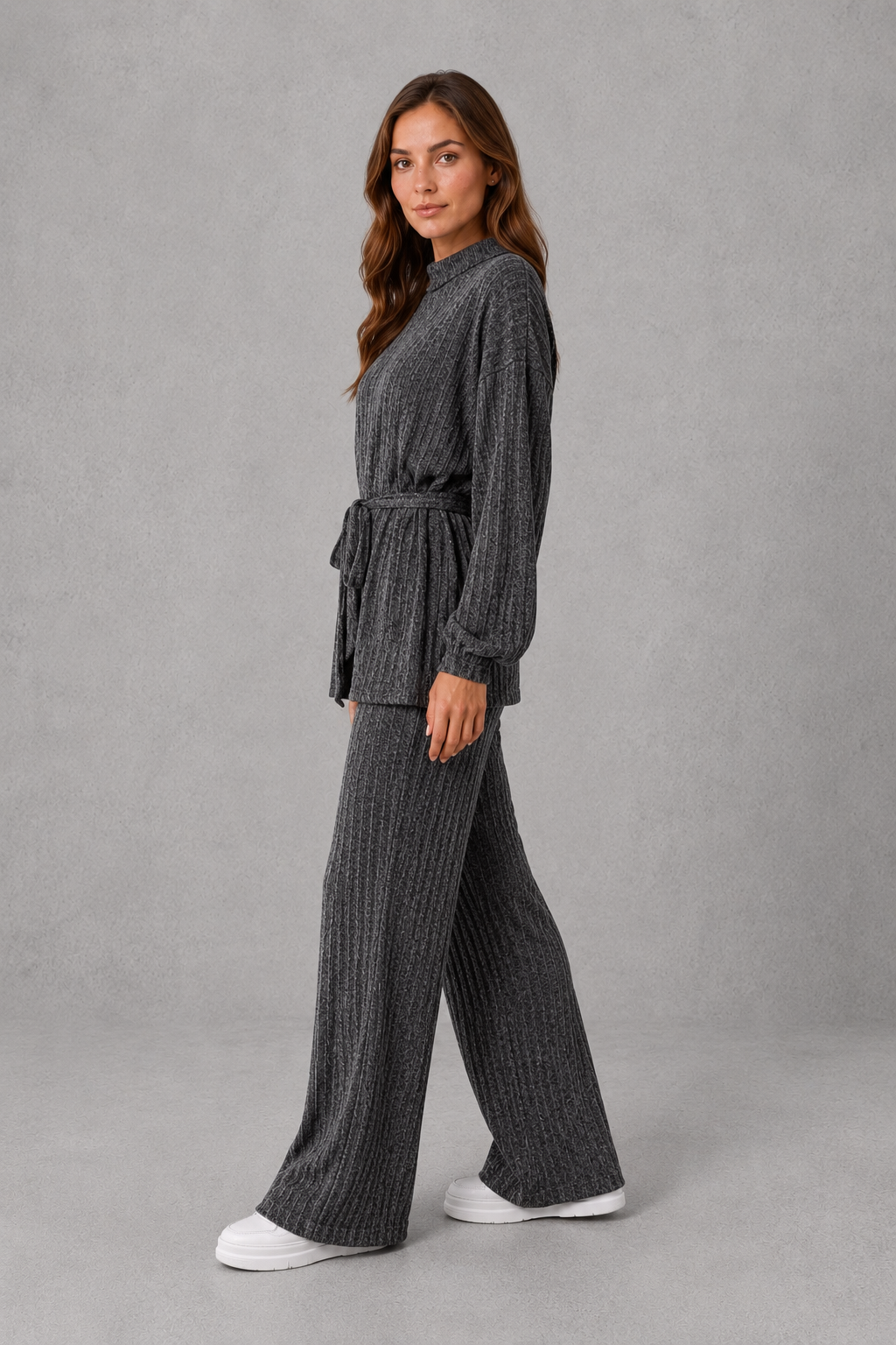 Women’s turtleneck knit two-piece set featuring a long-sleeve ribbed top with an adjustable tie waist and matching wide-leg pants.