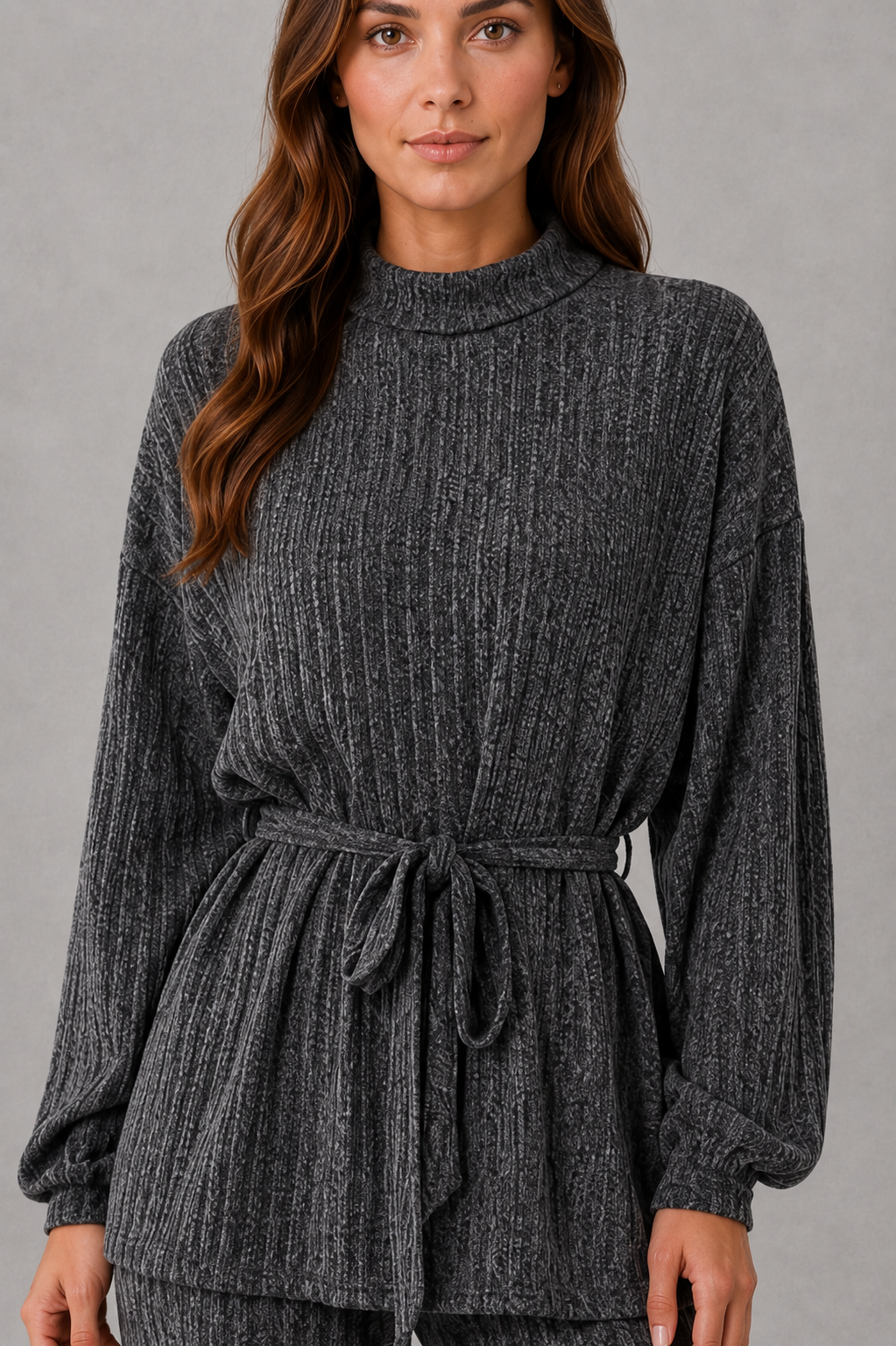 Women’s turtleneck knit two-piece set featuring a long-sleeve ribbed top with an adjustable tie waist and matching wide-leg pants.