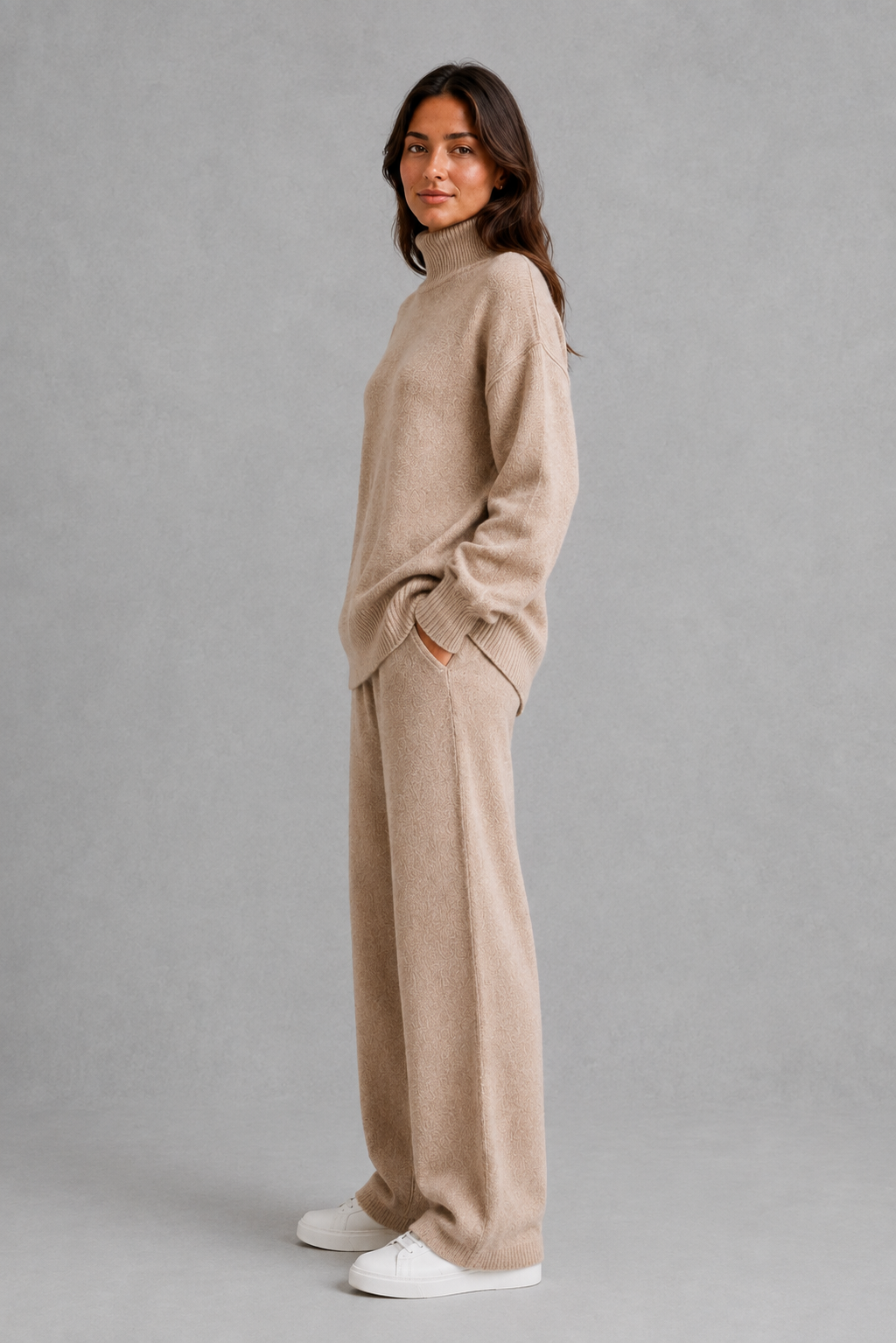 Women’s turtleneck sweater and pants set with an oversized ribbed high-neck sweater, dropped shoulders, long sleeves, and matching wide-leg knit pants.