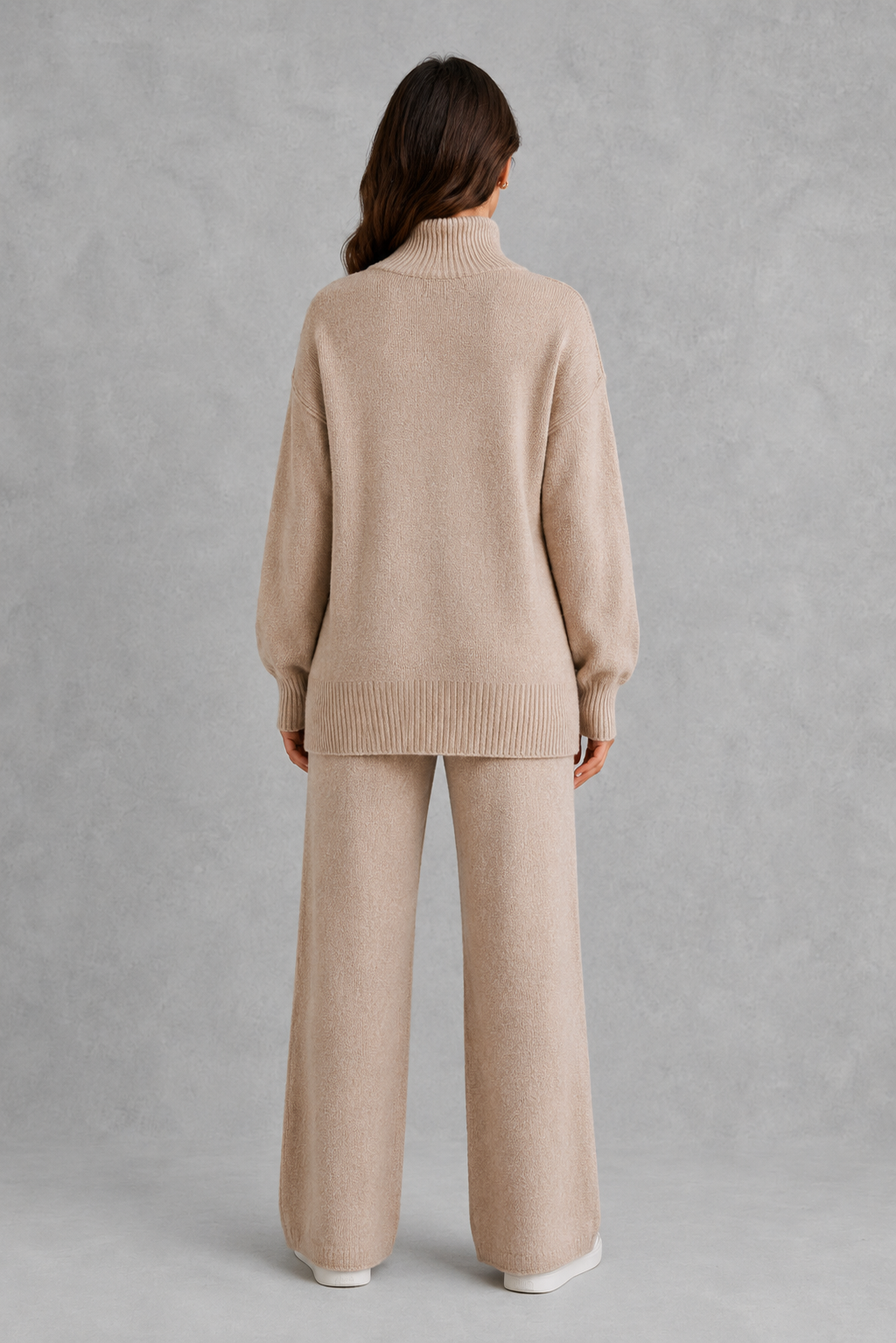 Women’s turtleneck sweater and pants set with an oversized ribbed high-neck sweater, dropped shoulders, long sleeves, and matching wide-leg knit pants.