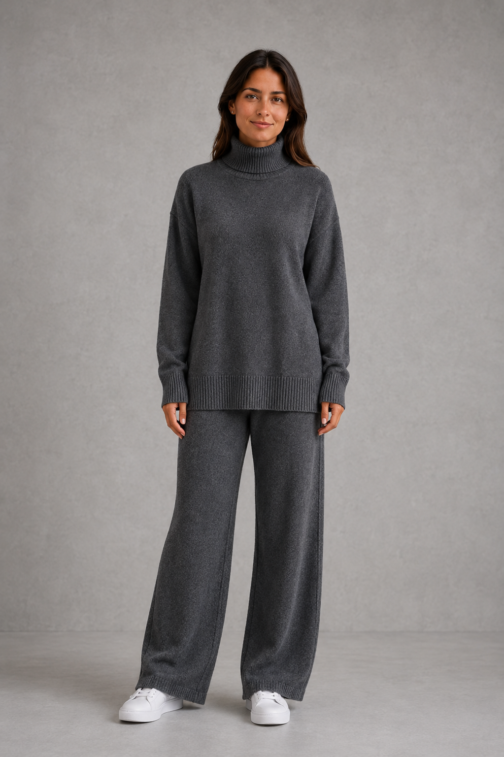 Women’s turtleneck sweater and pants set with an oversized ribbed high-neck sweater, dropped shoulders, long sleeves, and matching wide-leg knit pants.