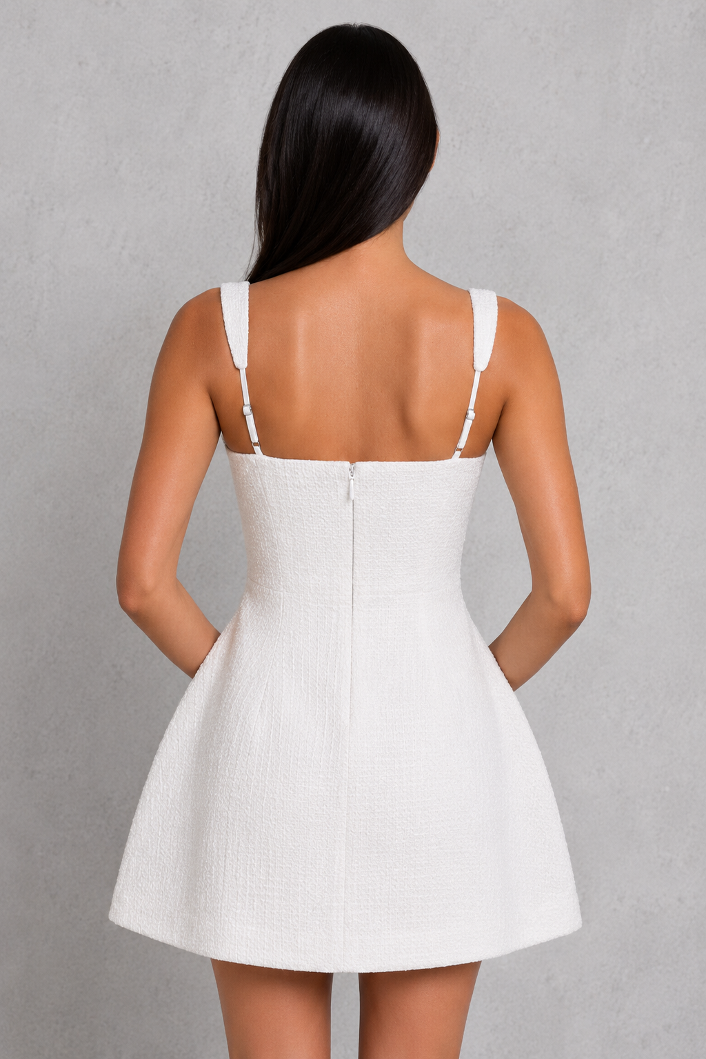 Women's tweed mini dress with a fitted bodice, square neckline, adjustable straps, and voluminous bubble skirt. Features textured tweed fabric, pearl-adorned pocket details, and a flattering sculpted silhouette, ideal for parties, celebrations, and special occasions.