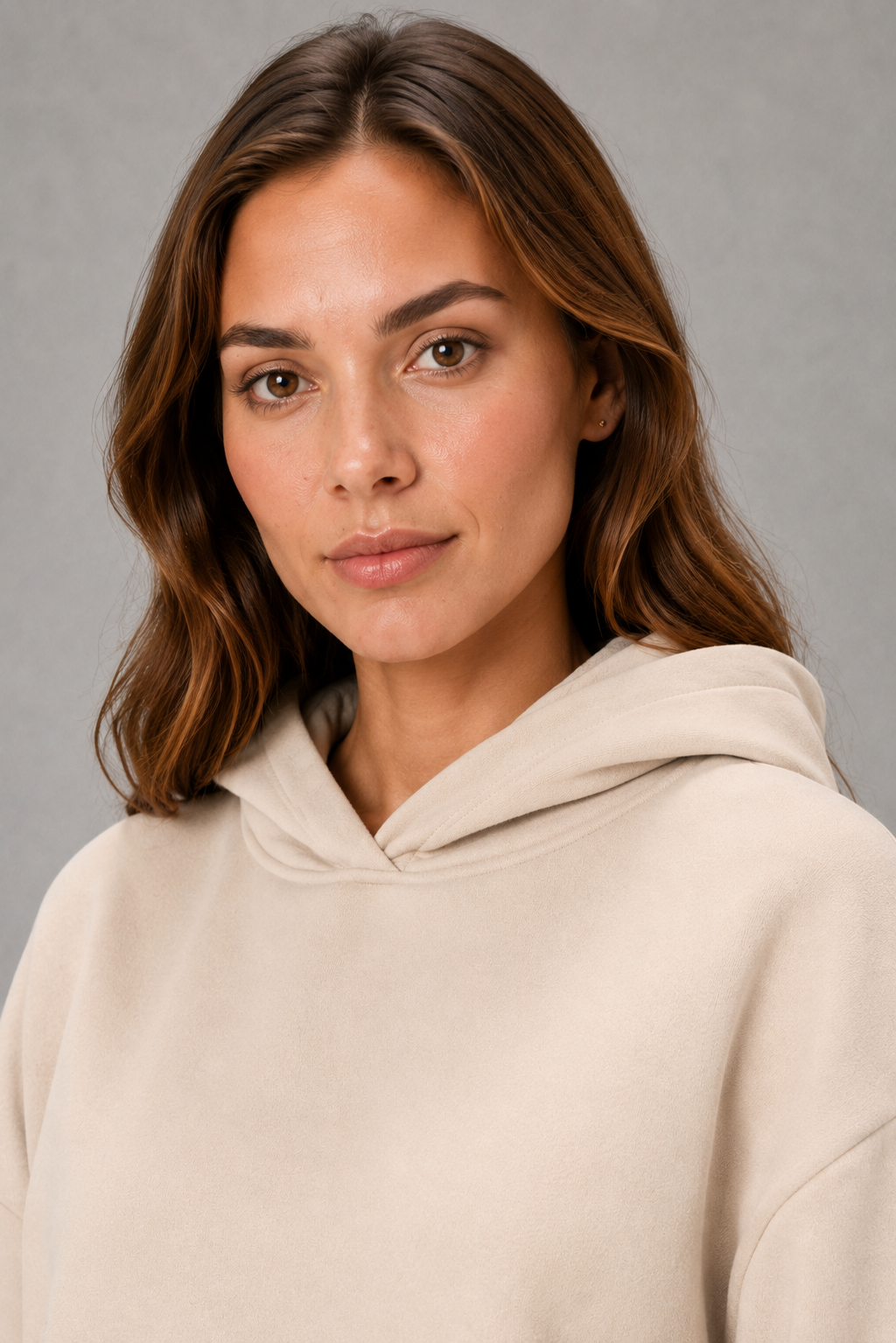 Women’s two-piece tracksuit set featuring a relaxed drawstring hoodie with front pocket and matching tapered jogger pants with cuffed ankles.