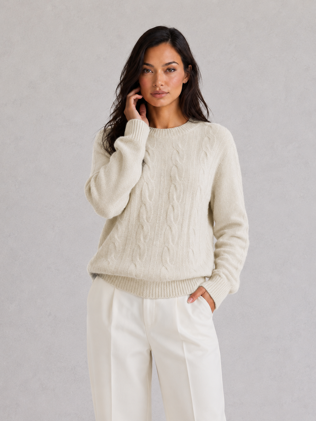 Woman wearing an ultra-soft knitted jumper with a relaxed fit, cozy texture, and modern silhouette styled for effortless everyday elegance.