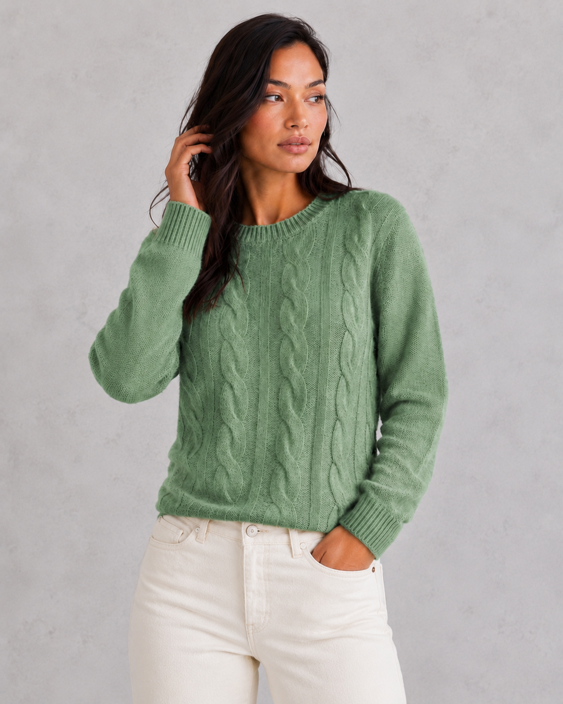 Woman wearing an ultra-soft knitted jumper with a relaxed fit, cozy texture, and modern silhouette styled for effortless everyday elegance.