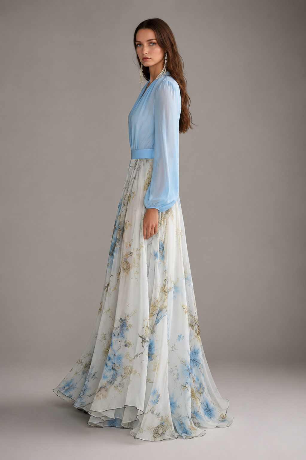 Women's floor-length floral maxi dress with a deep V-neckline, long gathered sleeves, a solid-color waistband, and a flowing multi-tone floral print skirt in a relaxed, elegant silhouette.