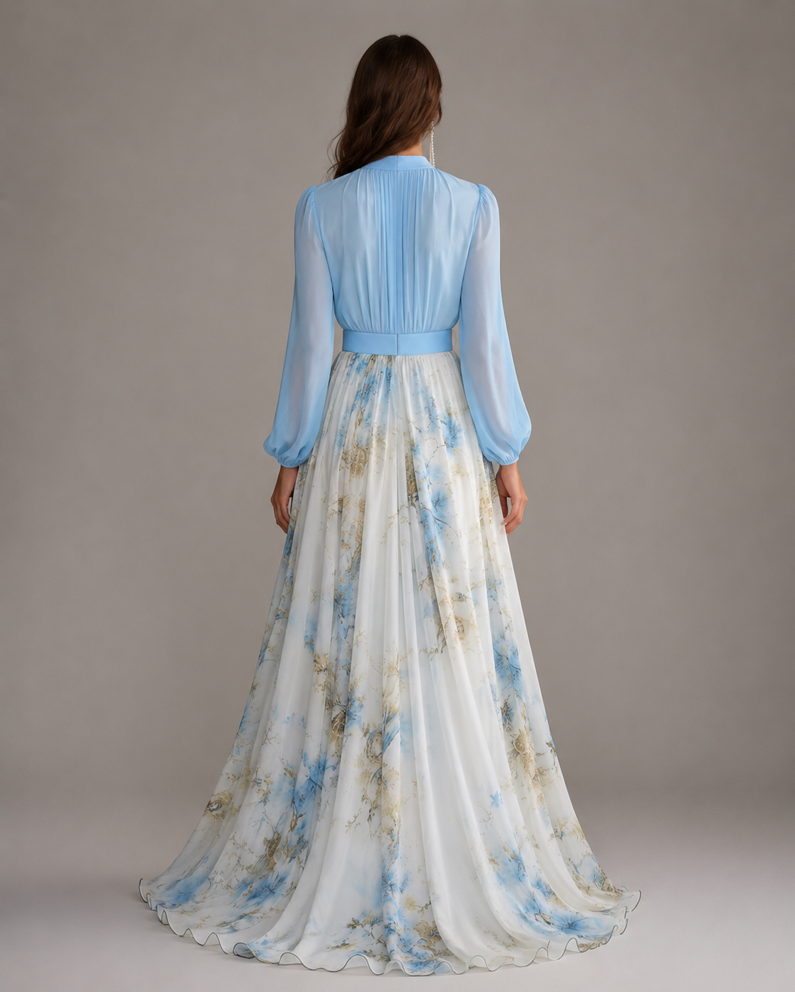 Women's floor-length floral maxi dress with a deep V-neckline, long gathered sleeves, a solid-color waistband, and a flowing multi-tone floral print skirt in a relaxed, elegant silhouette.