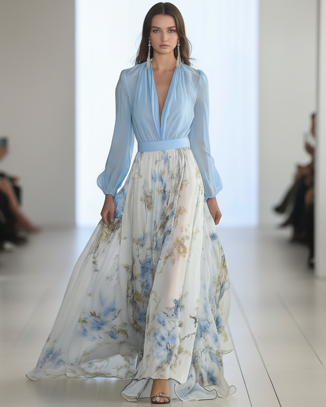 Women's floor-length floral maxi dress with a deep V-neckline, long gathered sleeves, a solid-color waistband, and a flowing multi-tone floral print skirt in a relaxed, elegant silhouette.