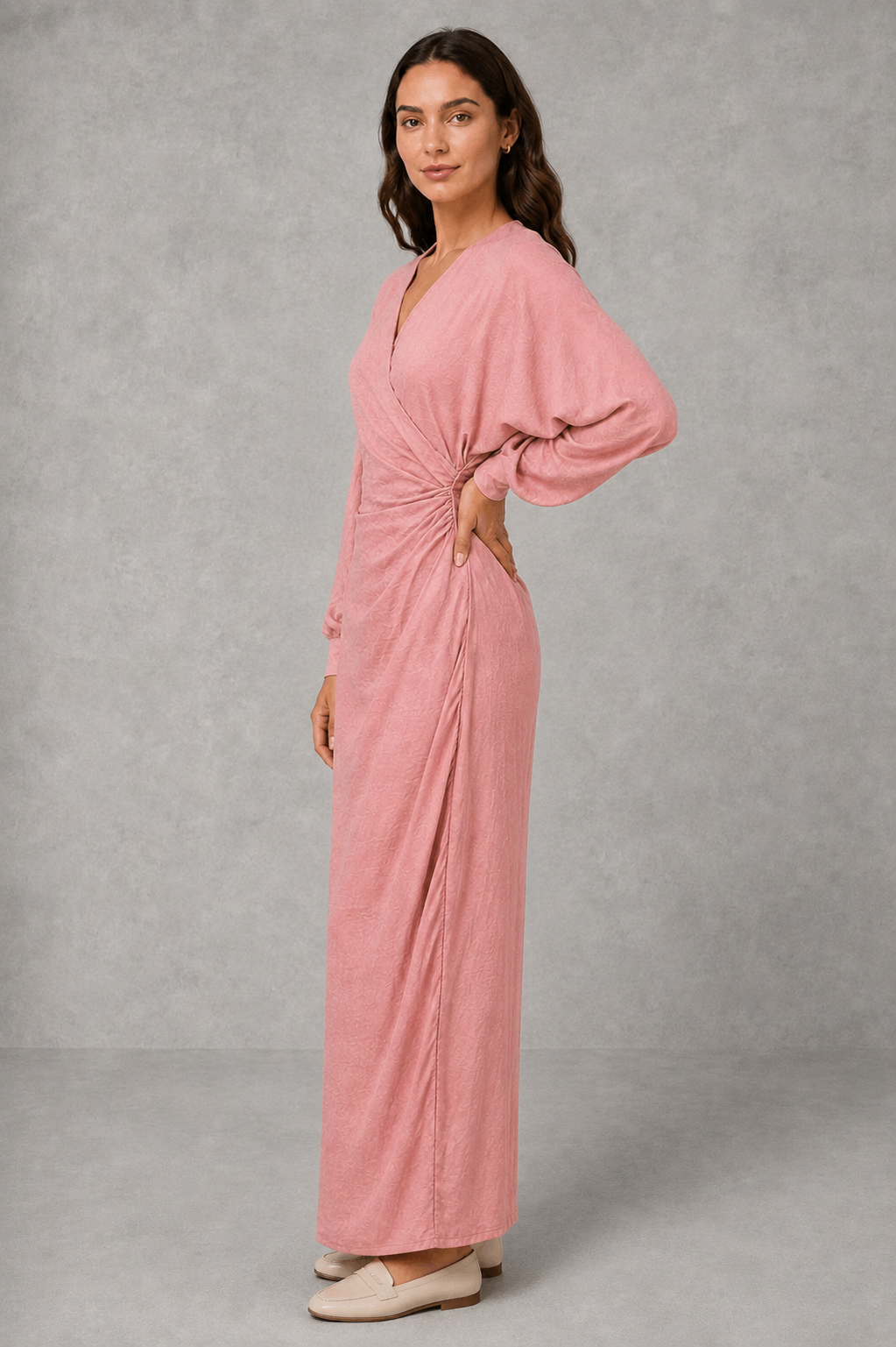 Women’s V-neck ruched wrap maxi dress with a draped front, gathered waist, long cuffed sleeves, flowing full-length skirt, and subtle side slit.