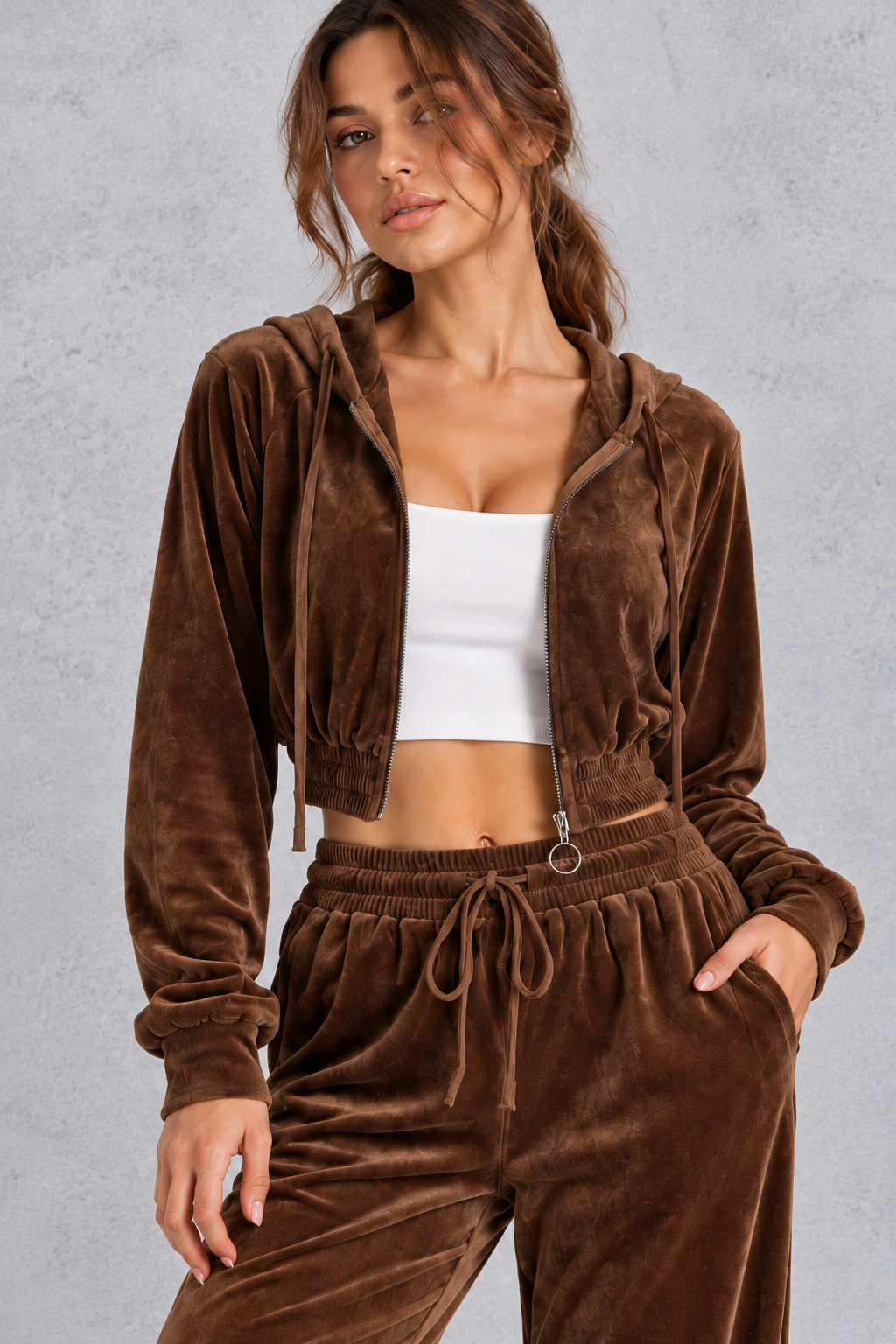 Close-up of the velvet texture and ring-pull front zip