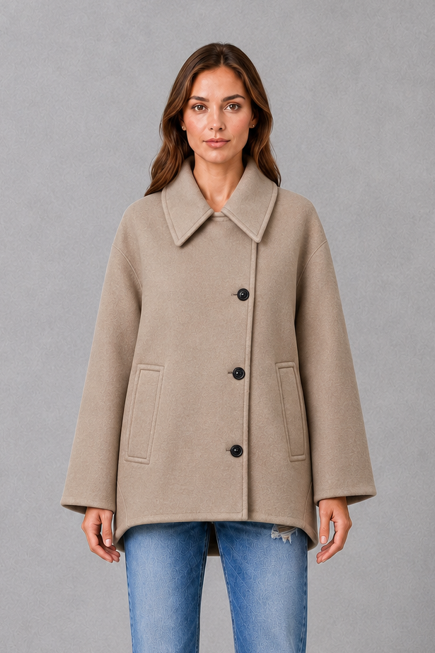 Women’s vintage-inspired longline coat with a relaxed silhouette, durable woven construction and practical front pockets for everyday layering.