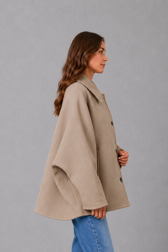 Women’s vintage-inspired longline coat with a relaxed silhouette, durable woven construction and practical front pockets for everyday layering.