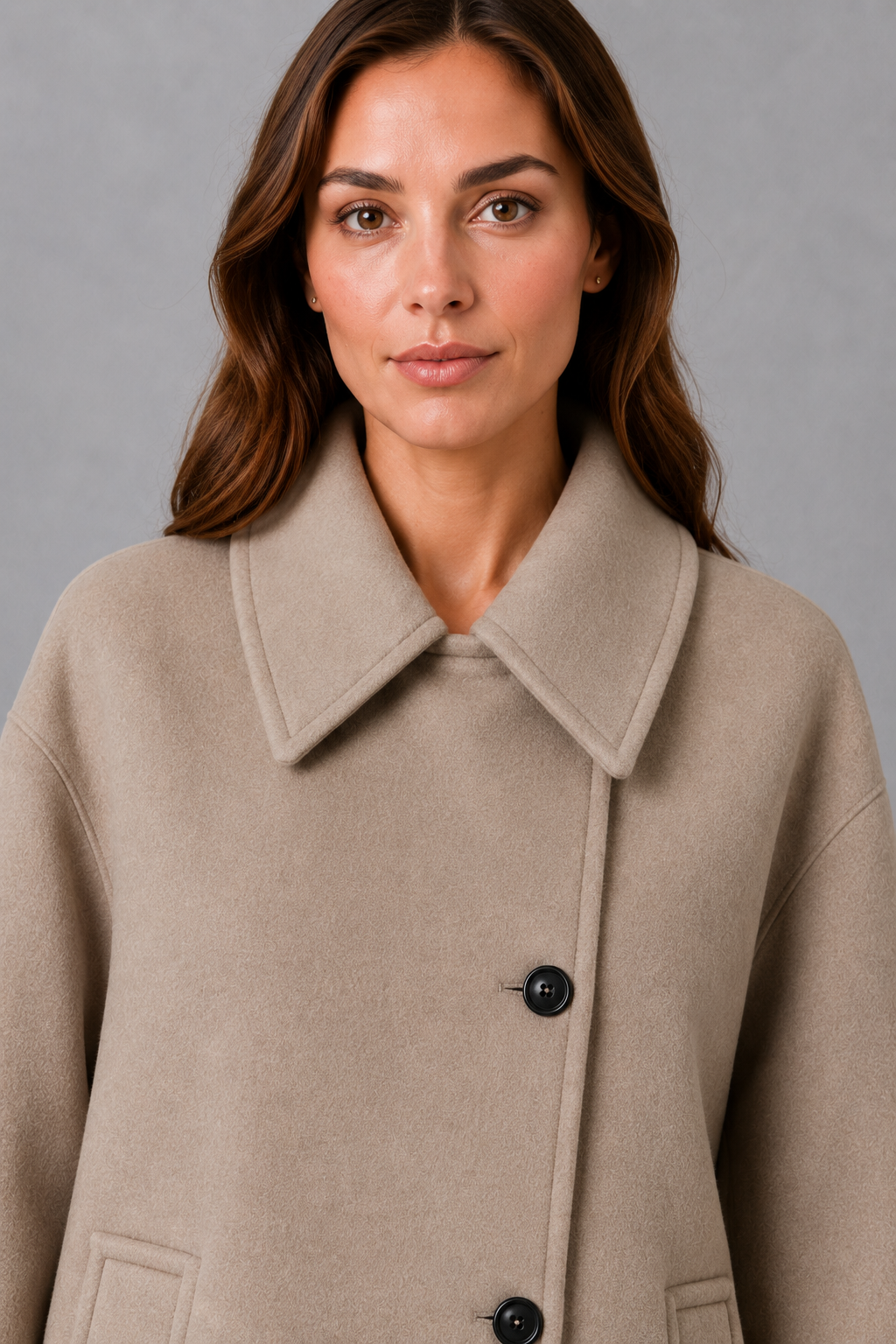 Women’s vintage-inspired longline coat with a relaxed silhouette, durable woven construction and practical front pockets for everyday layering.