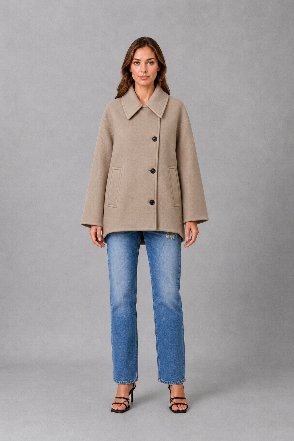 Women’s vintage-inspired longline coat with a relaxed silhouette, durable woven construction and practical front pockets for everyday layering.