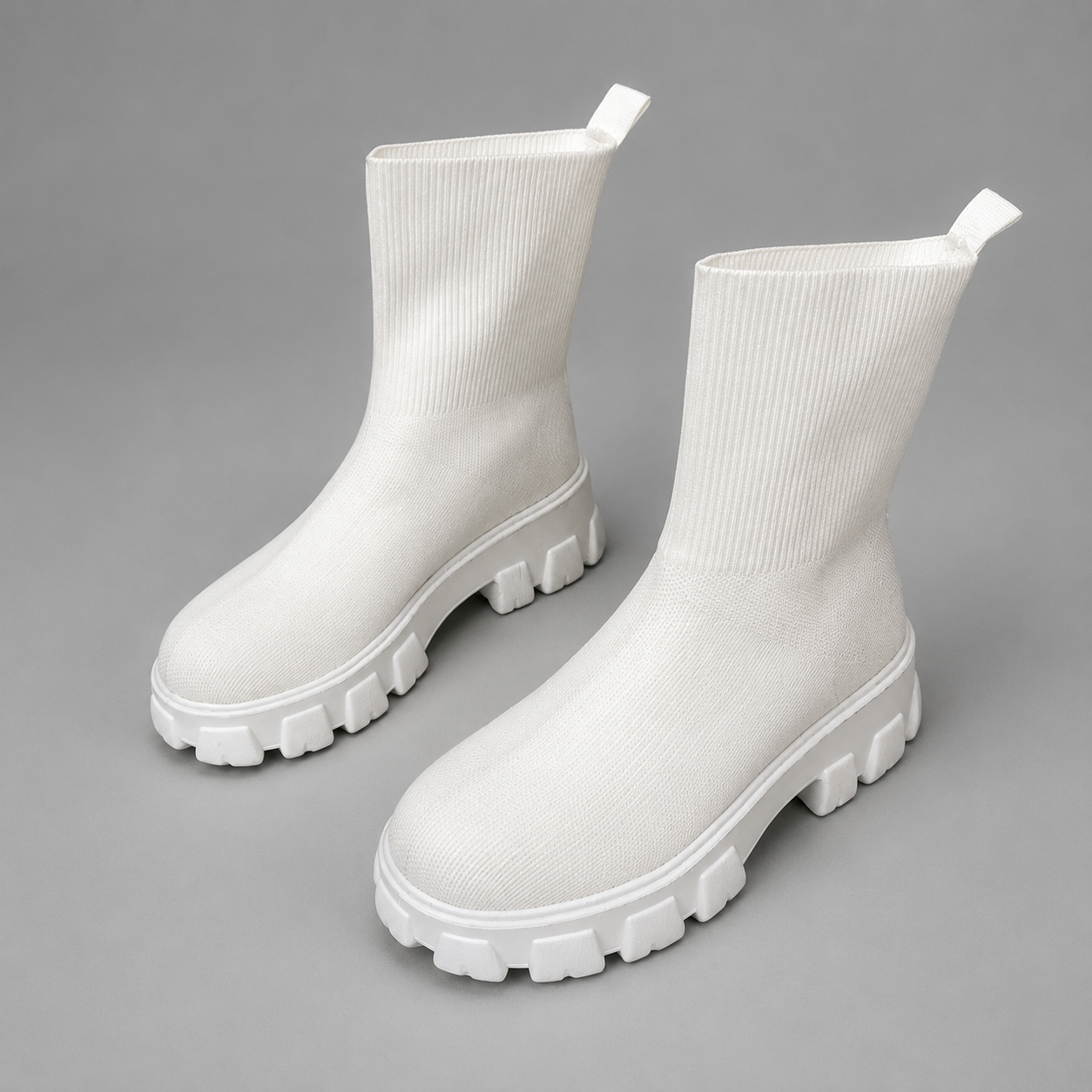 Women's waterproof stretch ankle boots with a faux fur lining, slip-on design, lace-up detail and non-slip rubber sole for warm, comfortable everyday autumn and winter wear.