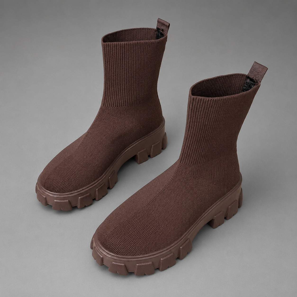 Women's waterproof stretch ankle boots with a faux fur lining, slip-on design, lace-up detail and non-slip rubber sole for warm, comfortable everyday autumn and winter wear.