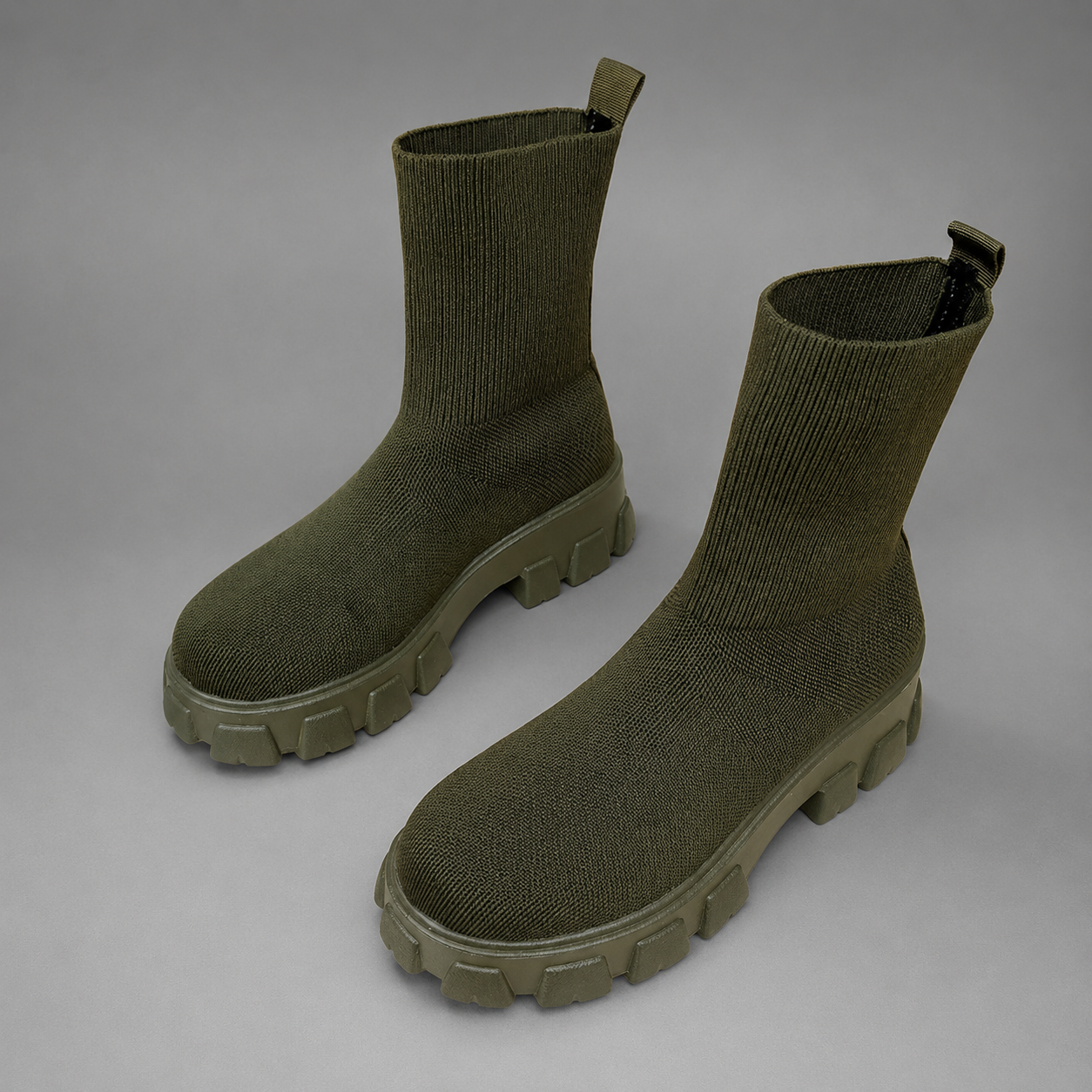 Women's waterproof stretch ankle boots with a faux fur lining, slip-on design, lace-up detail and non-slip rubber sole for warm, comfortable everyday autumn and winter wear.