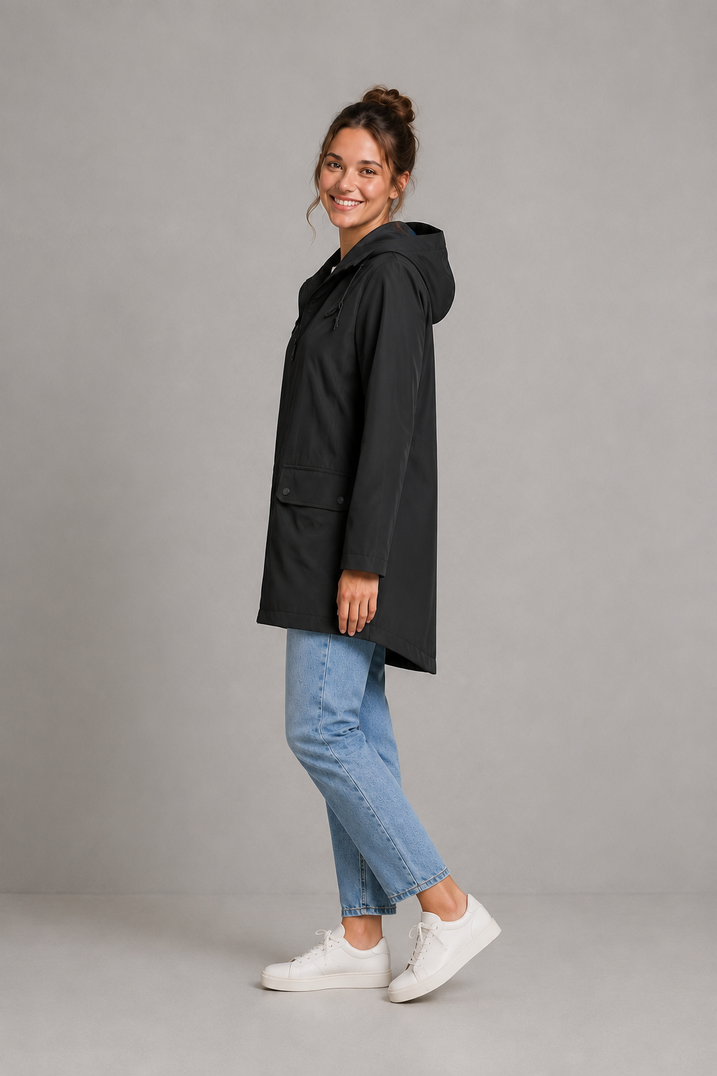Women’s waterproof windproof hooded coat with lightweight performance fabric, an adjustable protective hood and a flattering regular-fit silhouette.