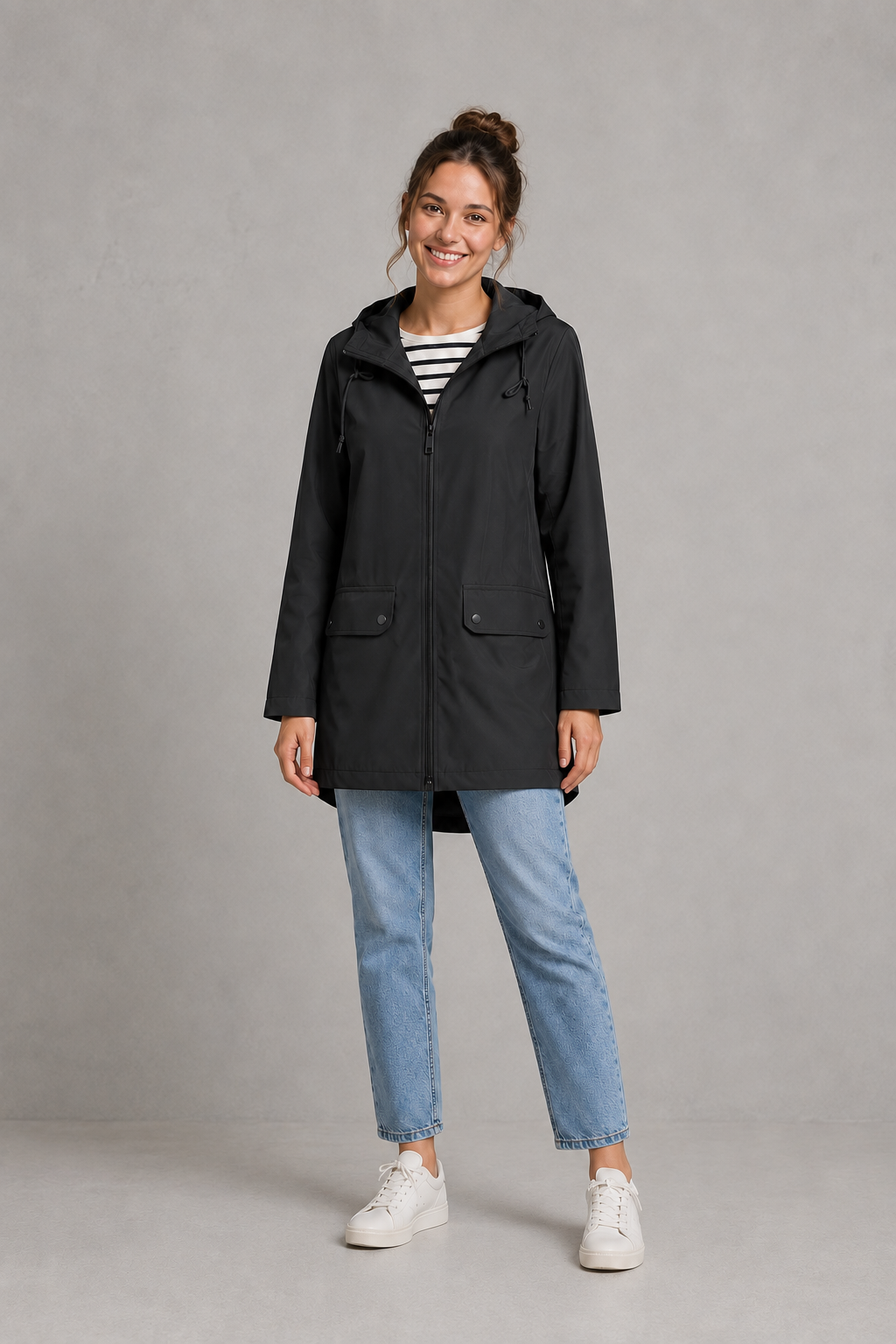 Women’s waterproof windproof hooded coat with lightweight performance fabric, an adjustable protective hood and a flattering regular-fit silhouette.
