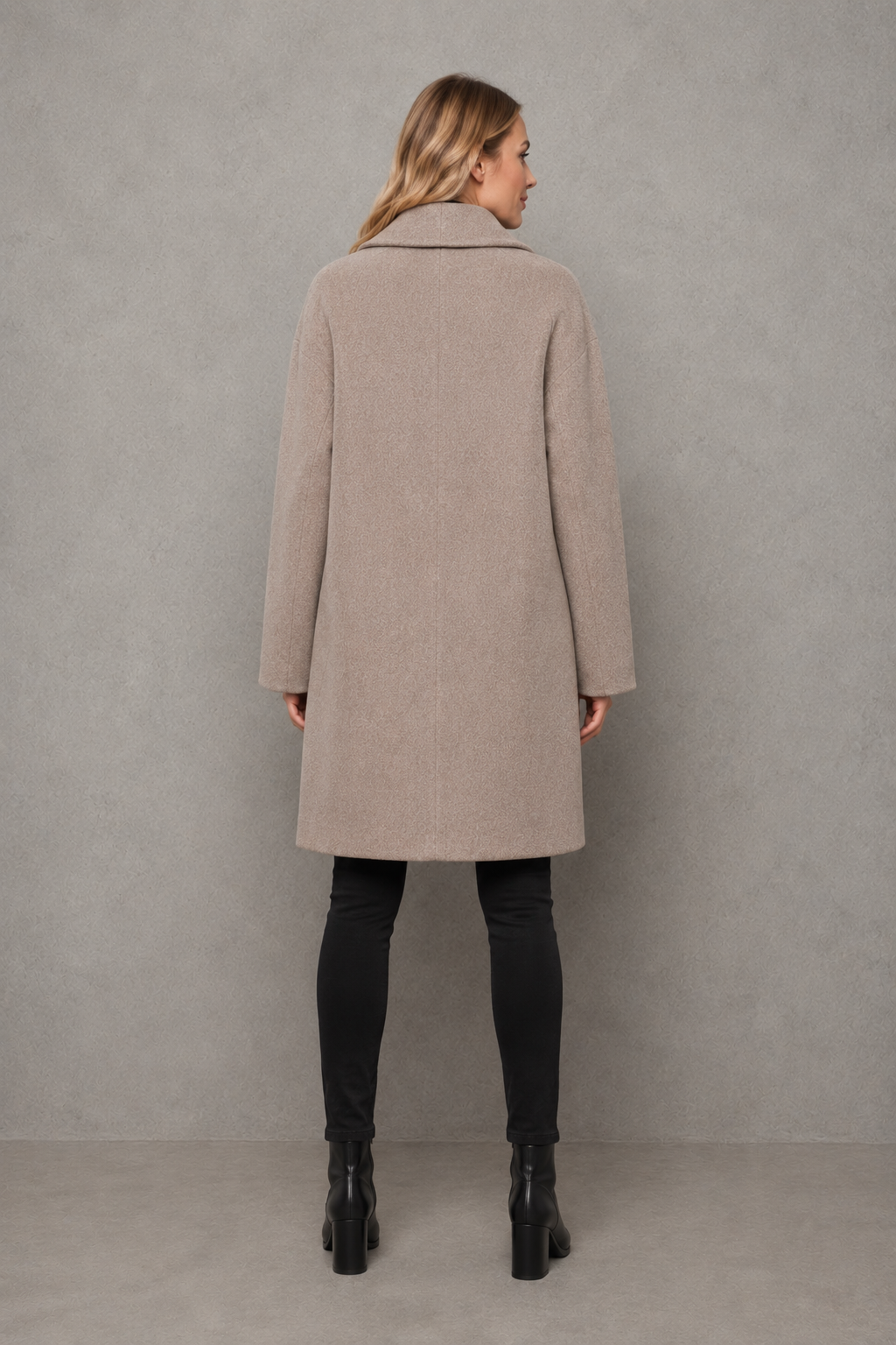 Women’s windproof winter coat with an elegant longline silhouette, relaxed fit, long sleeves, and soft lightweight fabric for comfortable layering.