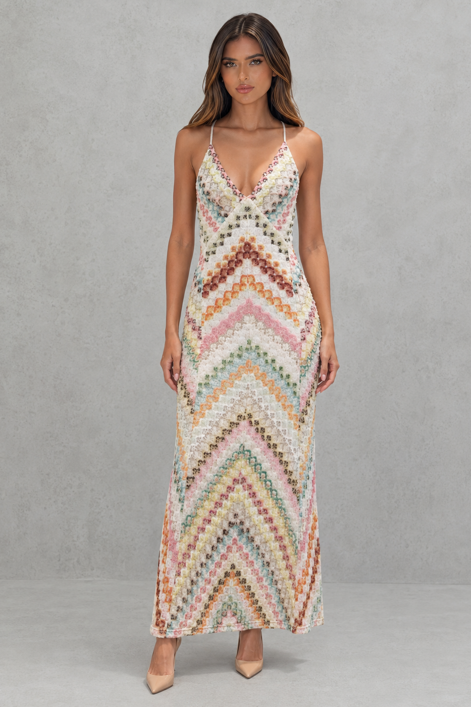 Women’s zigzag print maxi dress with a V-neckline, delicate shoulder straps, open back, and flowing full-length skirt.