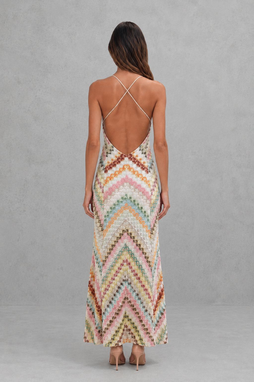 Women’s zigzag print maxi dress with a V-neckline, delicate shoulder straps, open back, and flowing full-length skirt.