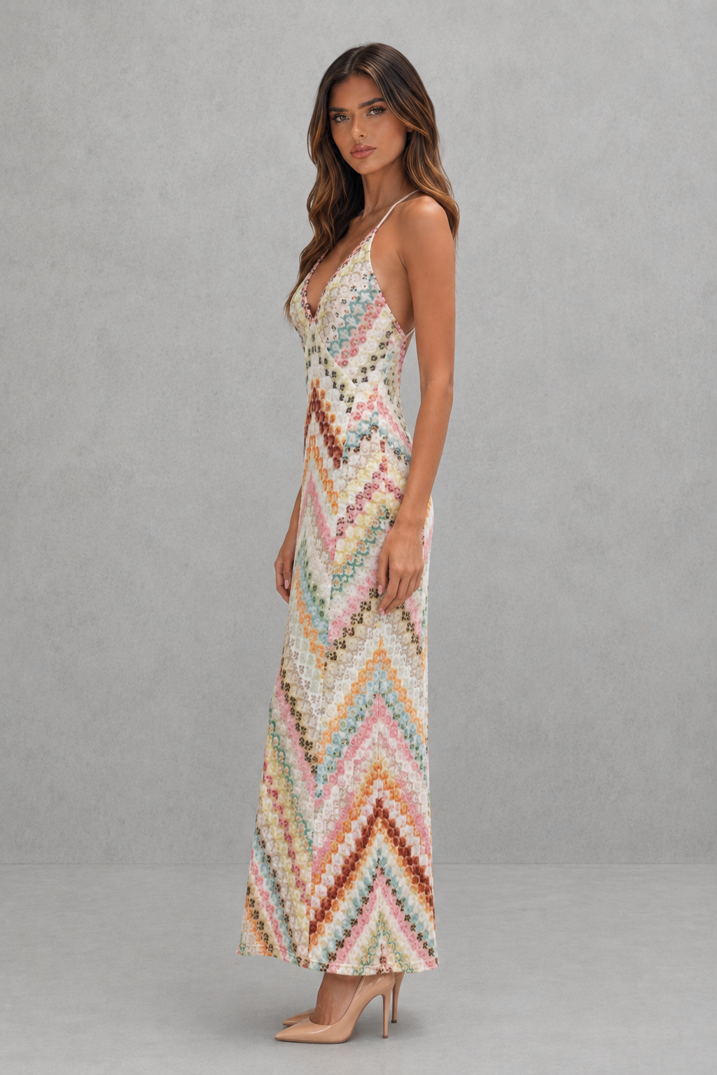 Women’s zigzag print maxi dress with a V-neckline, delicate shoulder straps, open back, and flowing full-length skirt.